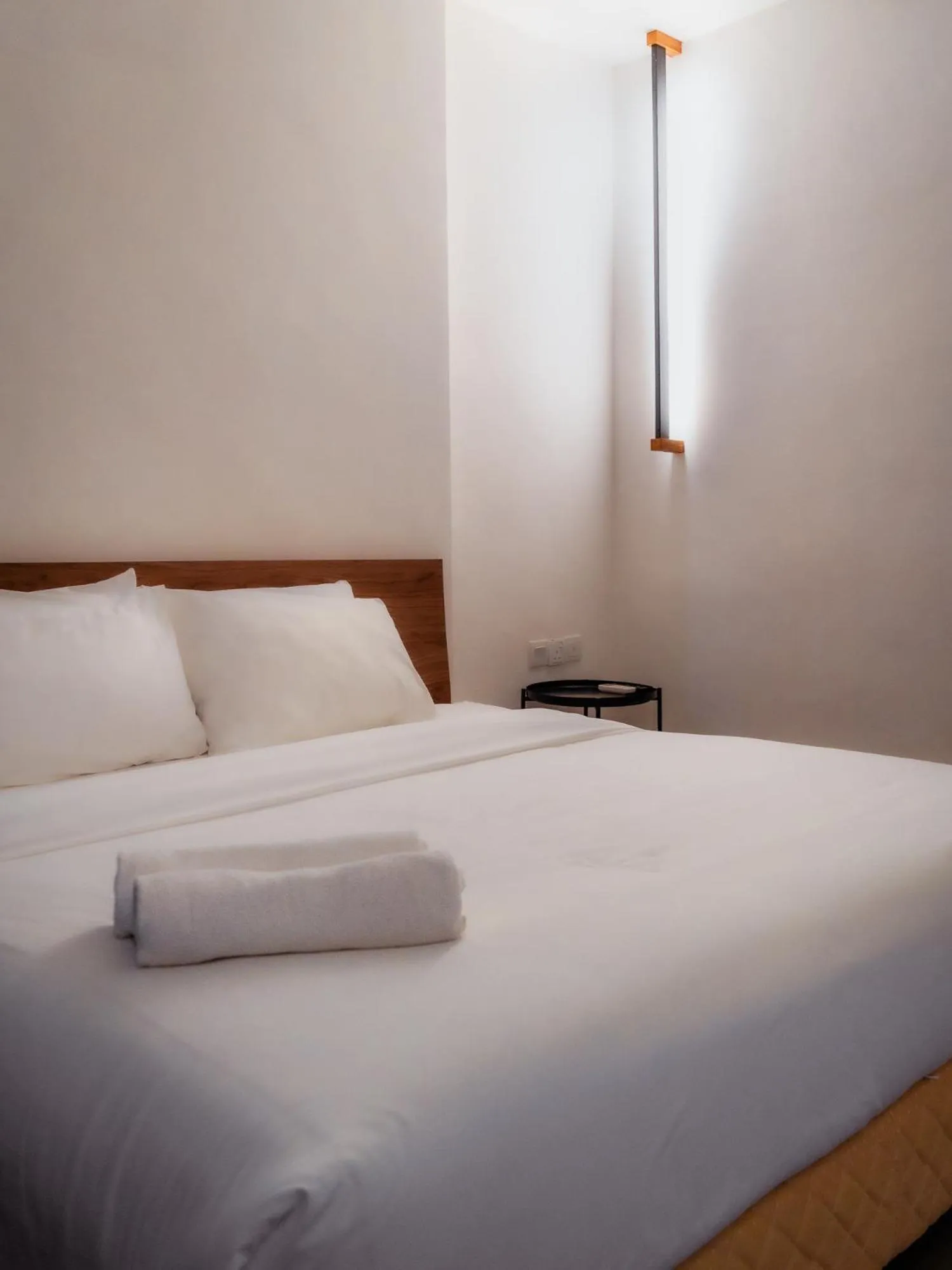 Bed in T+ PREMIUM HOTEL