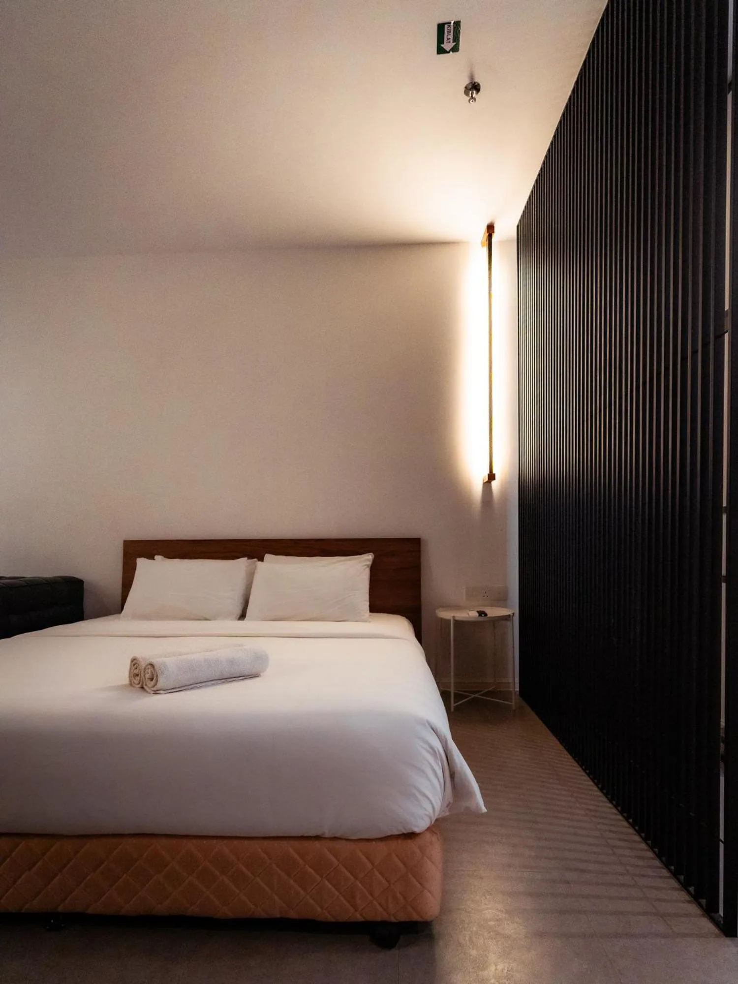 Bed in T+ PREMIUM HOTEL