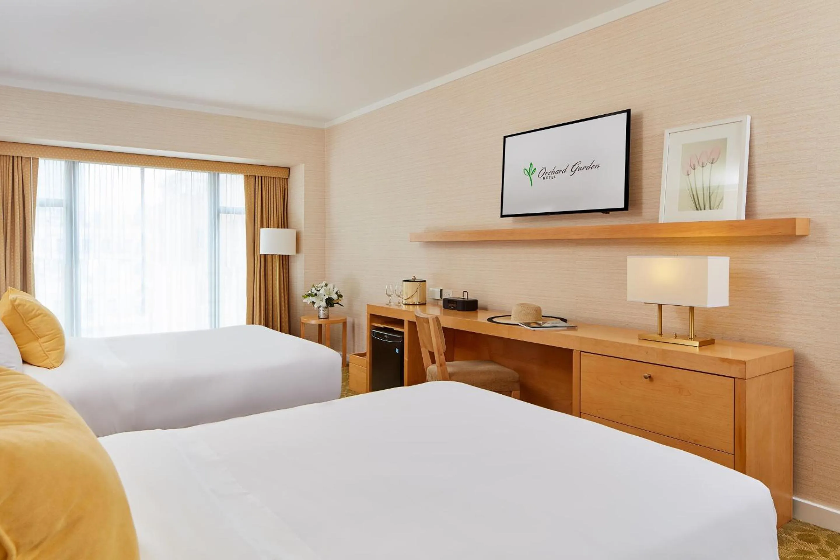 Bed in Orchard Garden Hotel