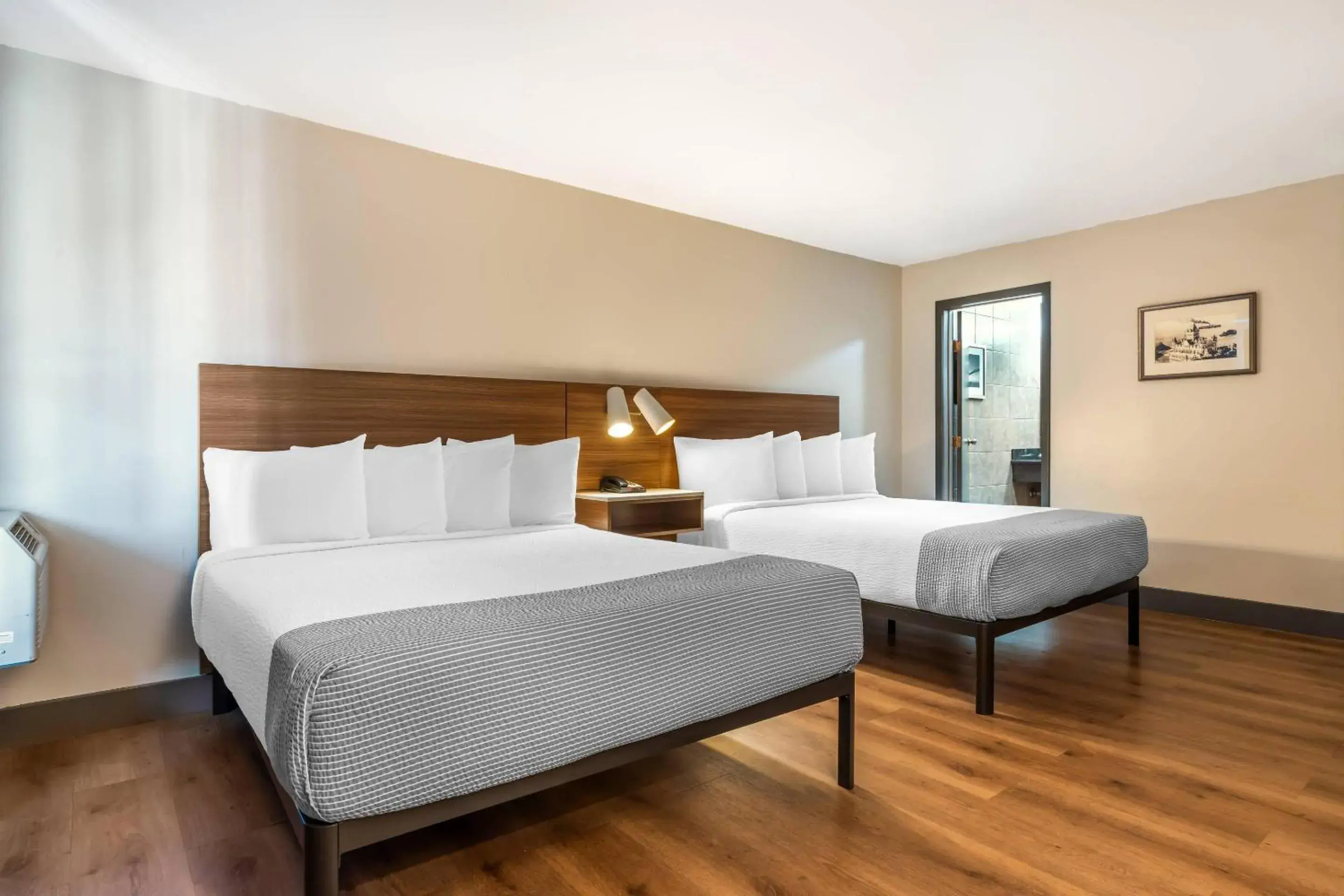 Large Quadruple Room with Two Queen Beds - Non Smoking in La Luna Inn, an Ascend Collection Hotel Large Quadruple Room with Two Queen Beds - Non Smoking in La Luna Inn, an Ascend Collection Hotel