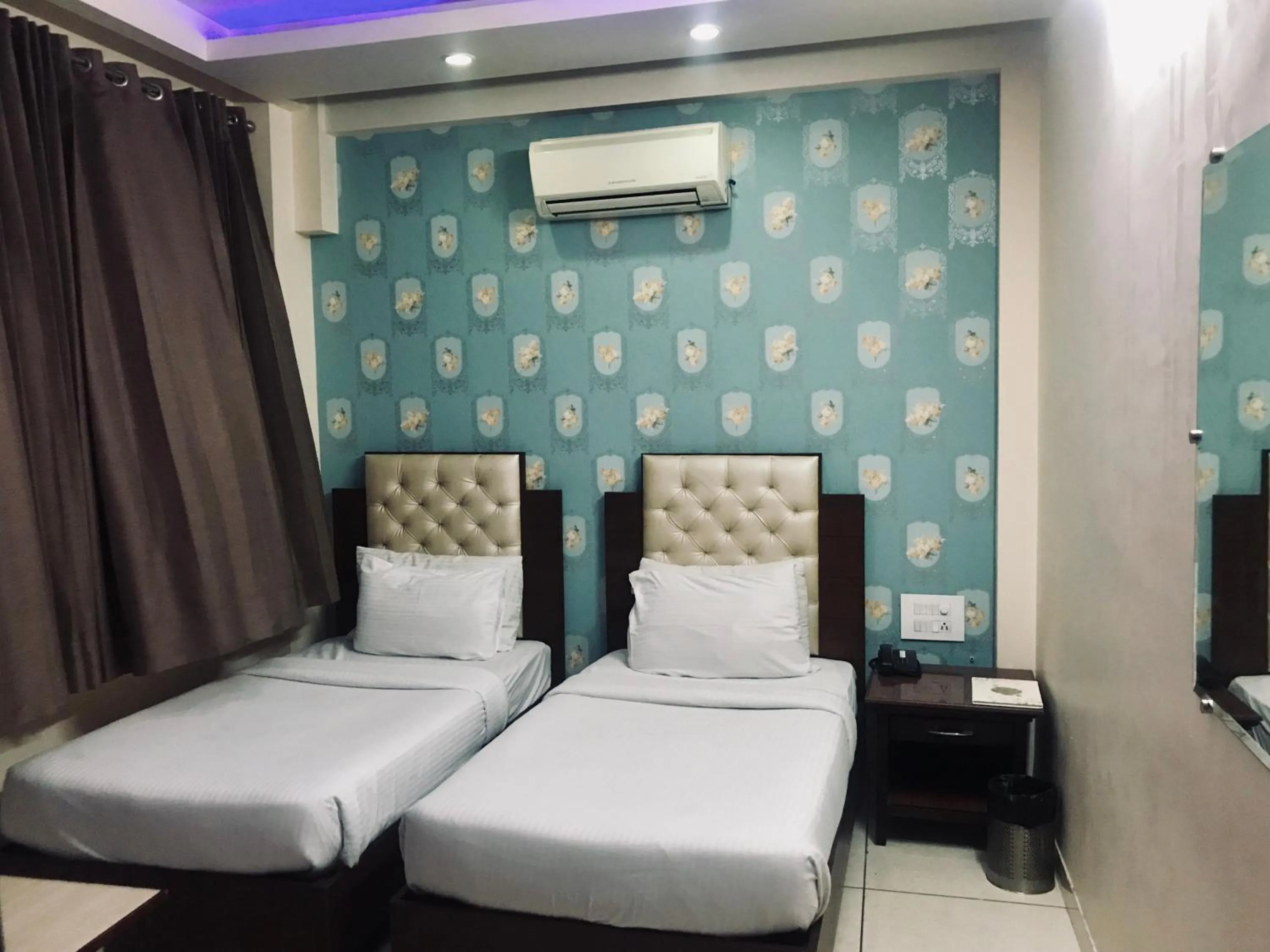 Photo of the whole room, Bed in Leela Residency