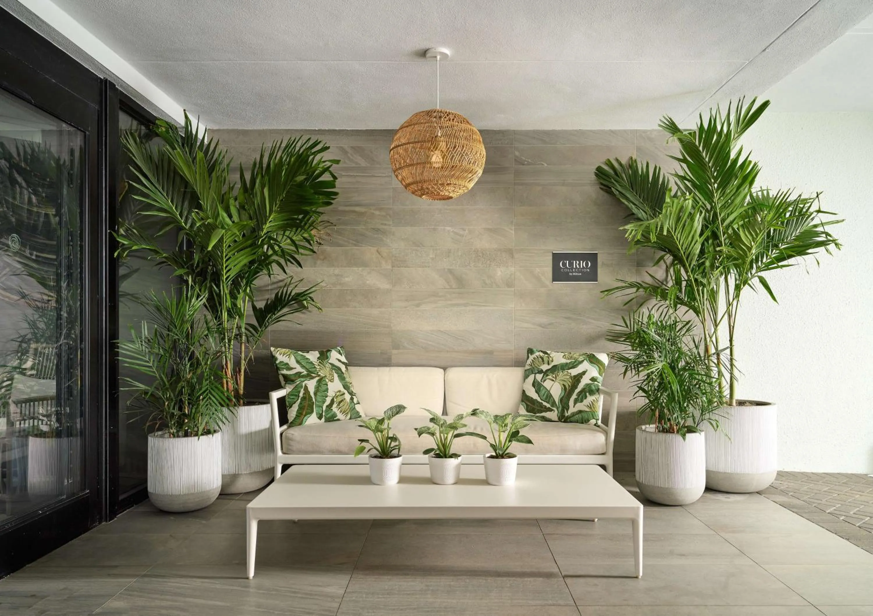 Communal lounge/ TV room in Waterstone Resort & Marina Boca Raton, Curio Collection by Hilton