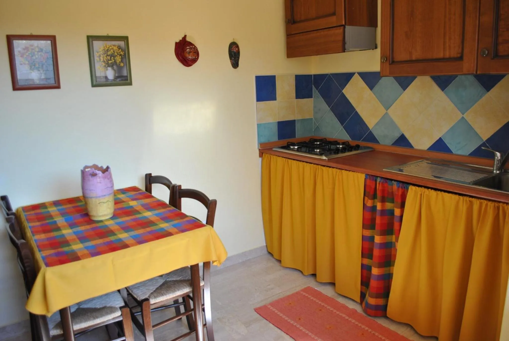 Kitchen or kitchenette in affittacamere S'Ortensia