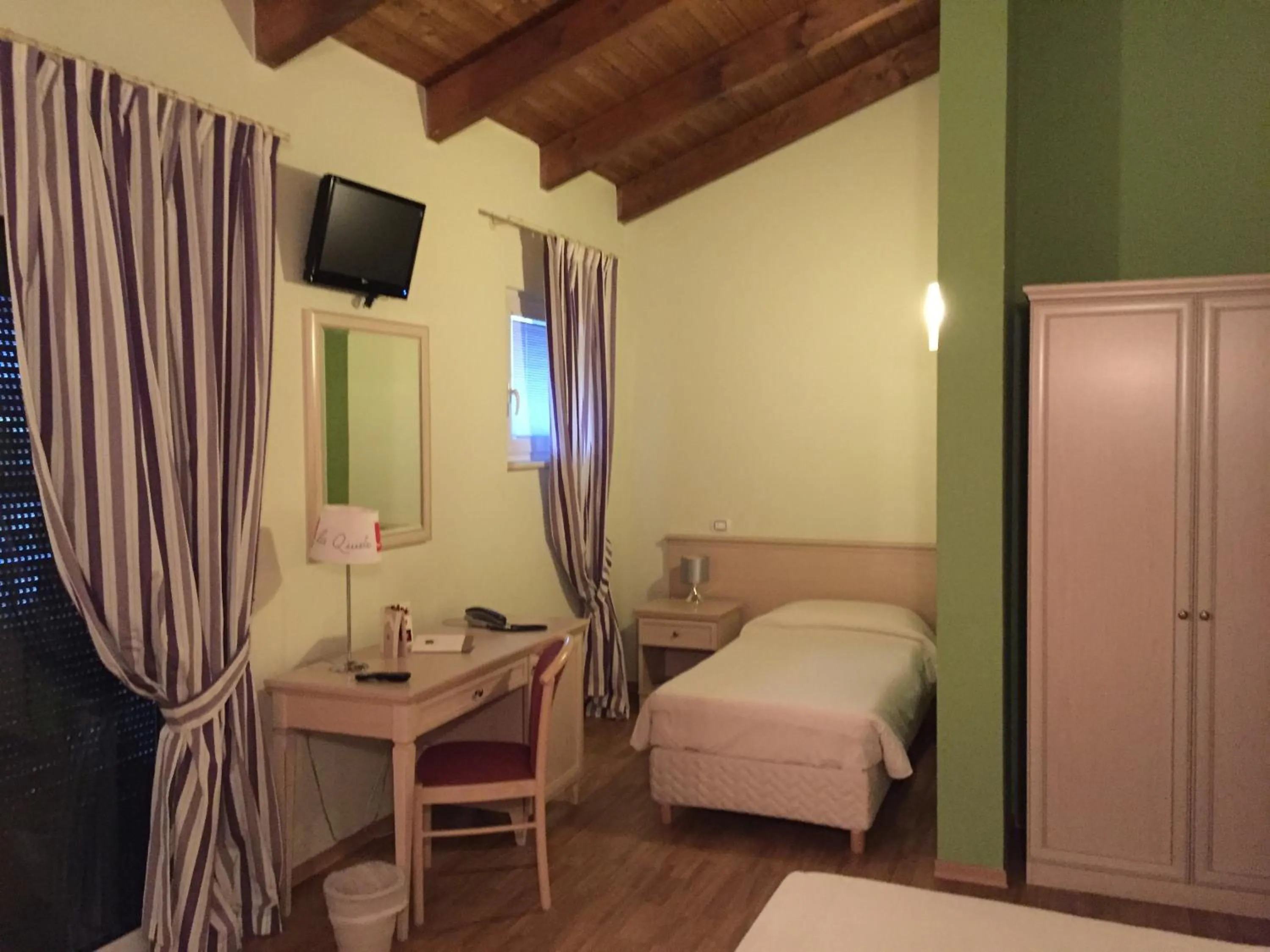 Photo of the whole room, Bed in Albergo La Quiete