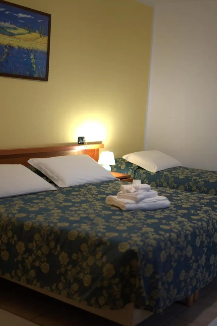 Bed in Hotel Il Melograno