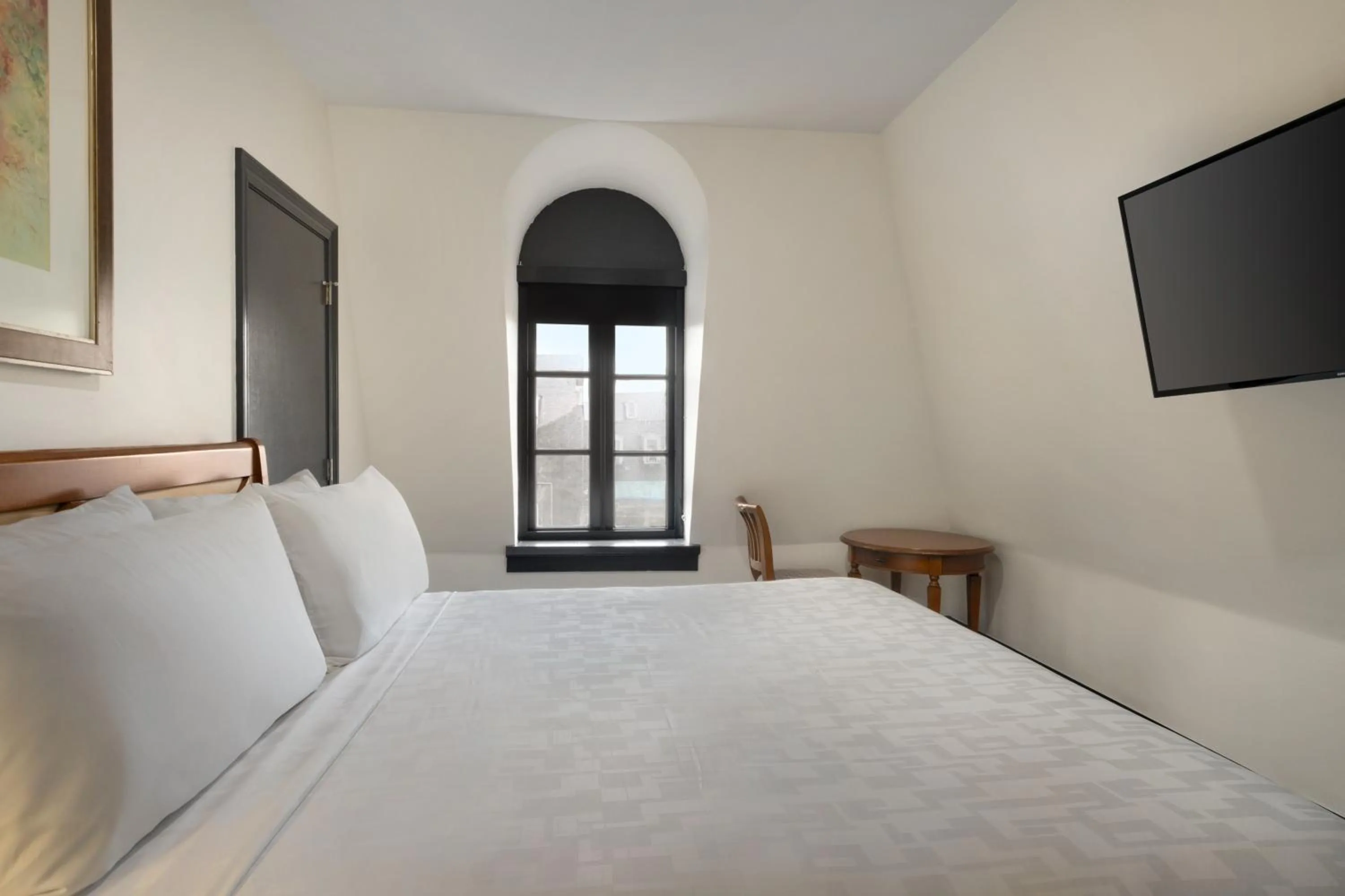 Bed in Le Richelieu Hotel in the French Quarter