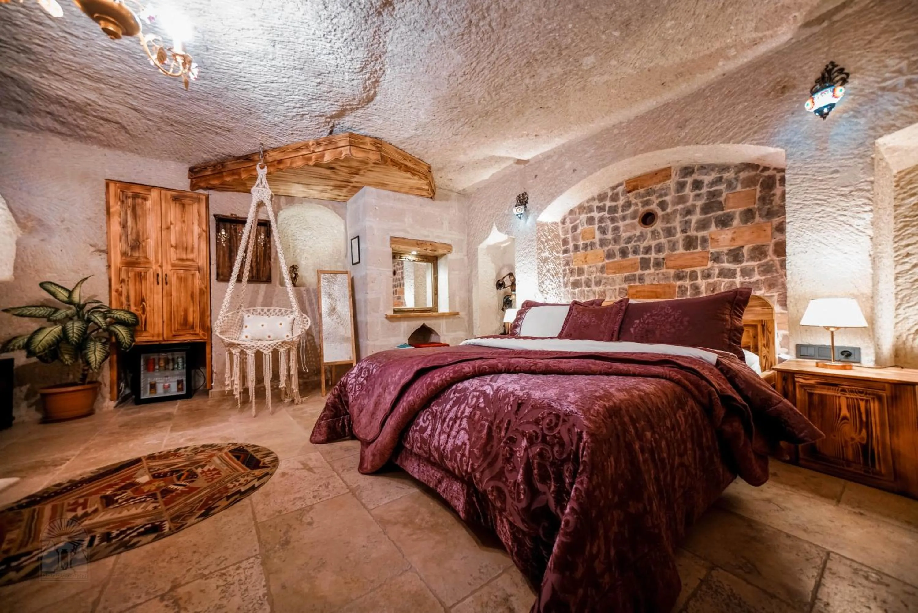 Bed in Zeus Cave Suites