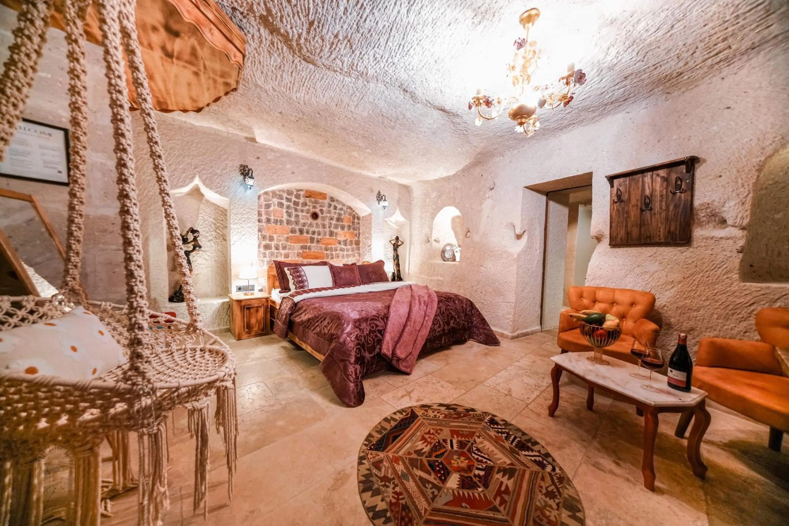 Bed in Zeus Cave Suites