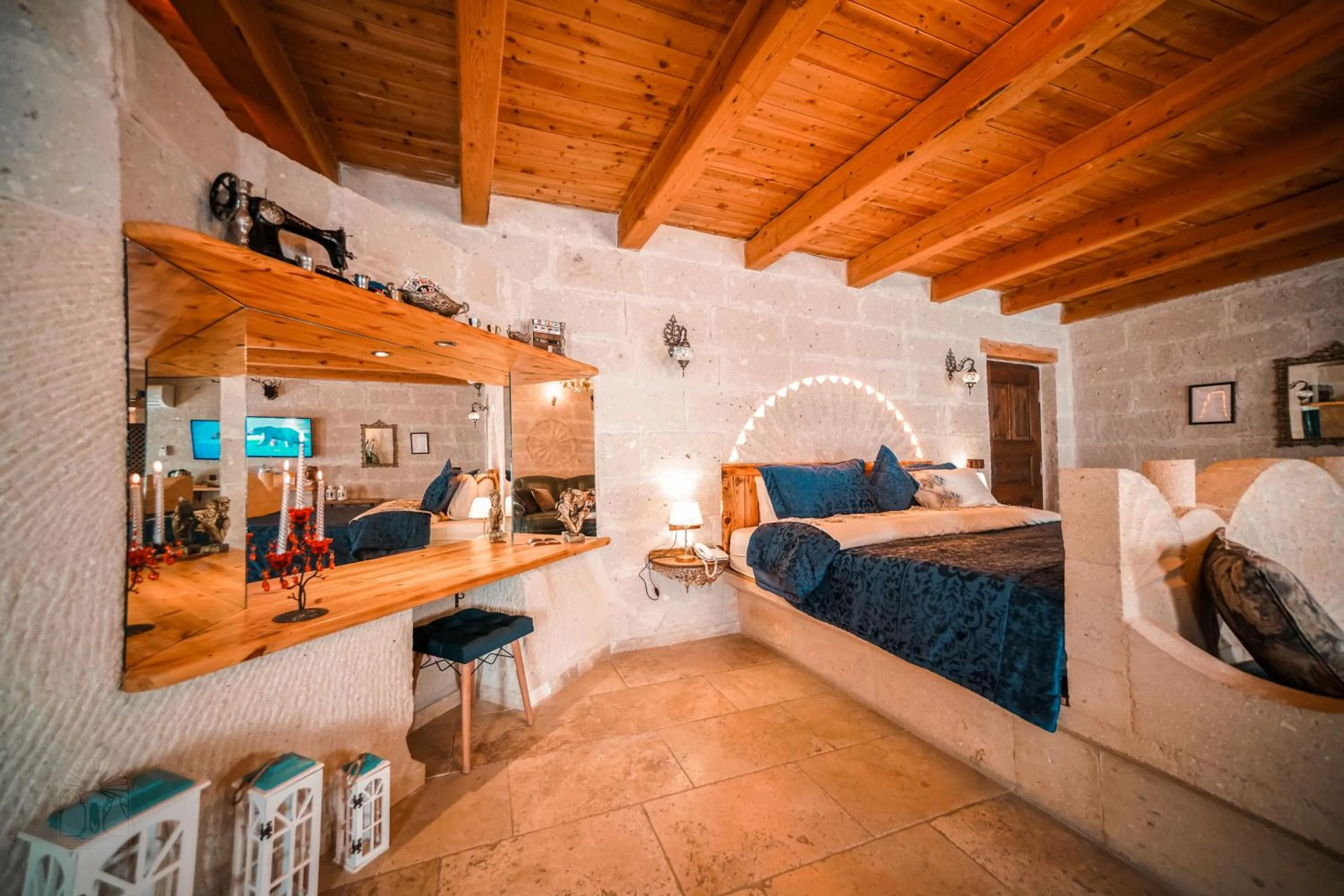 Bed in Zeus Cave Suites