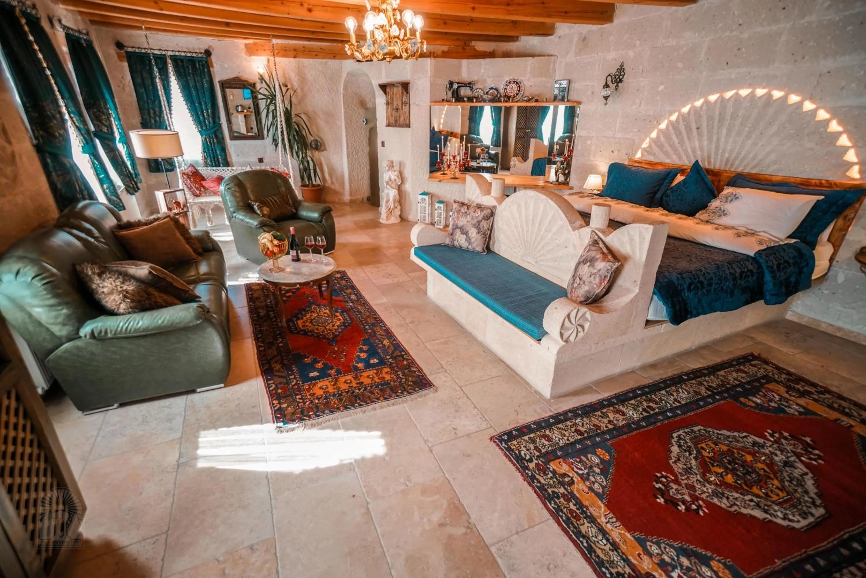 Bed in Zeus Cave Suites