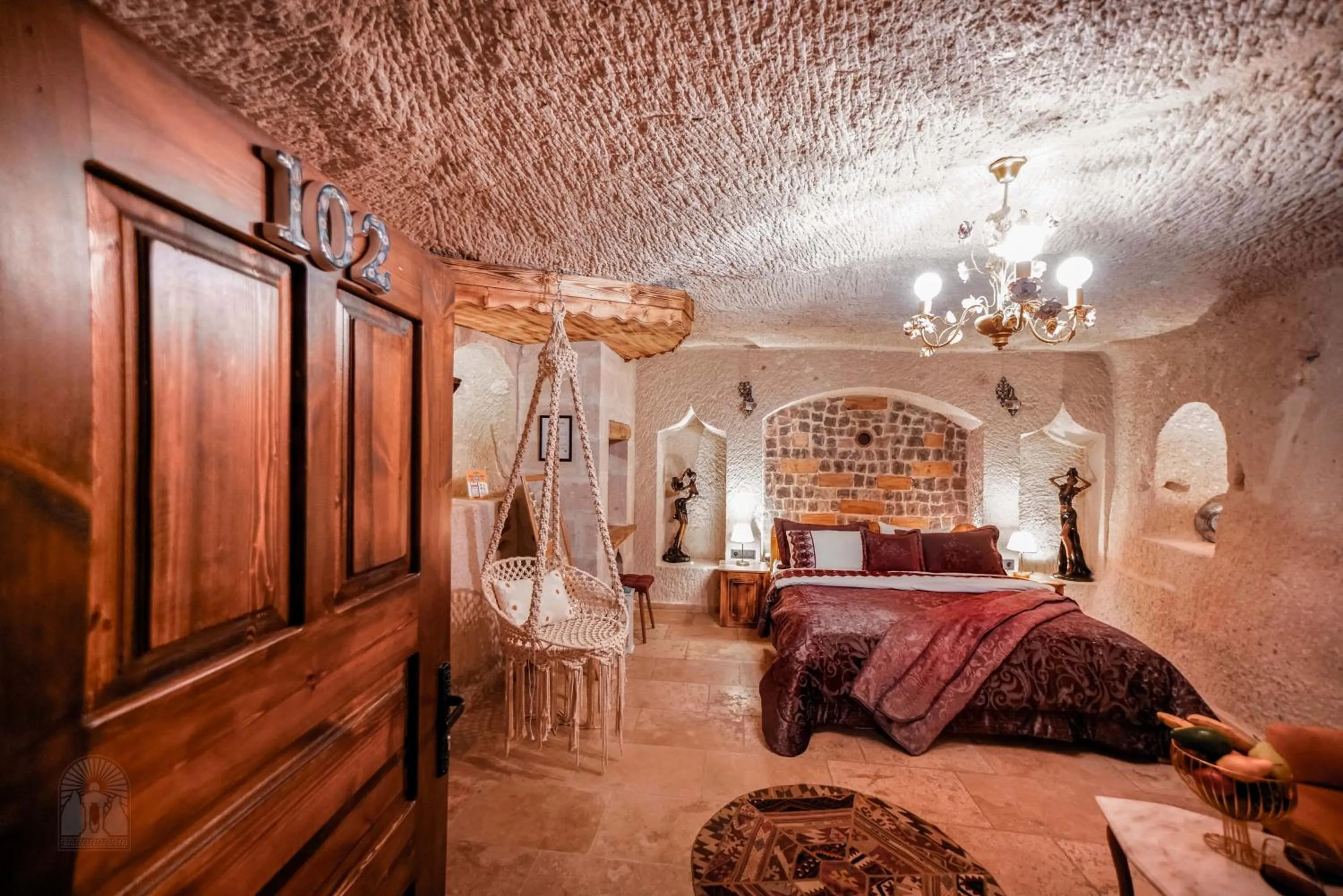 Bed in Zeus Cave Suites