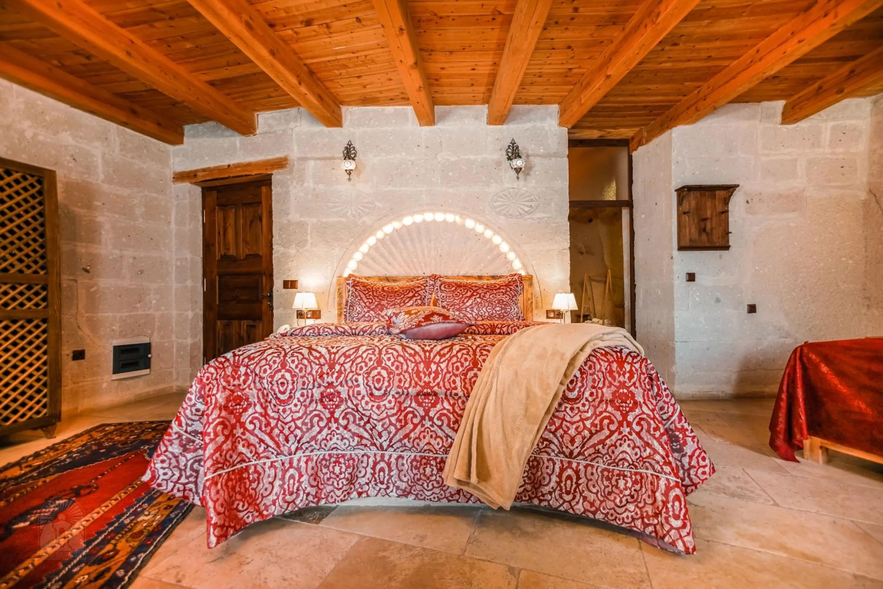 Bed in Zeus Cave Suites