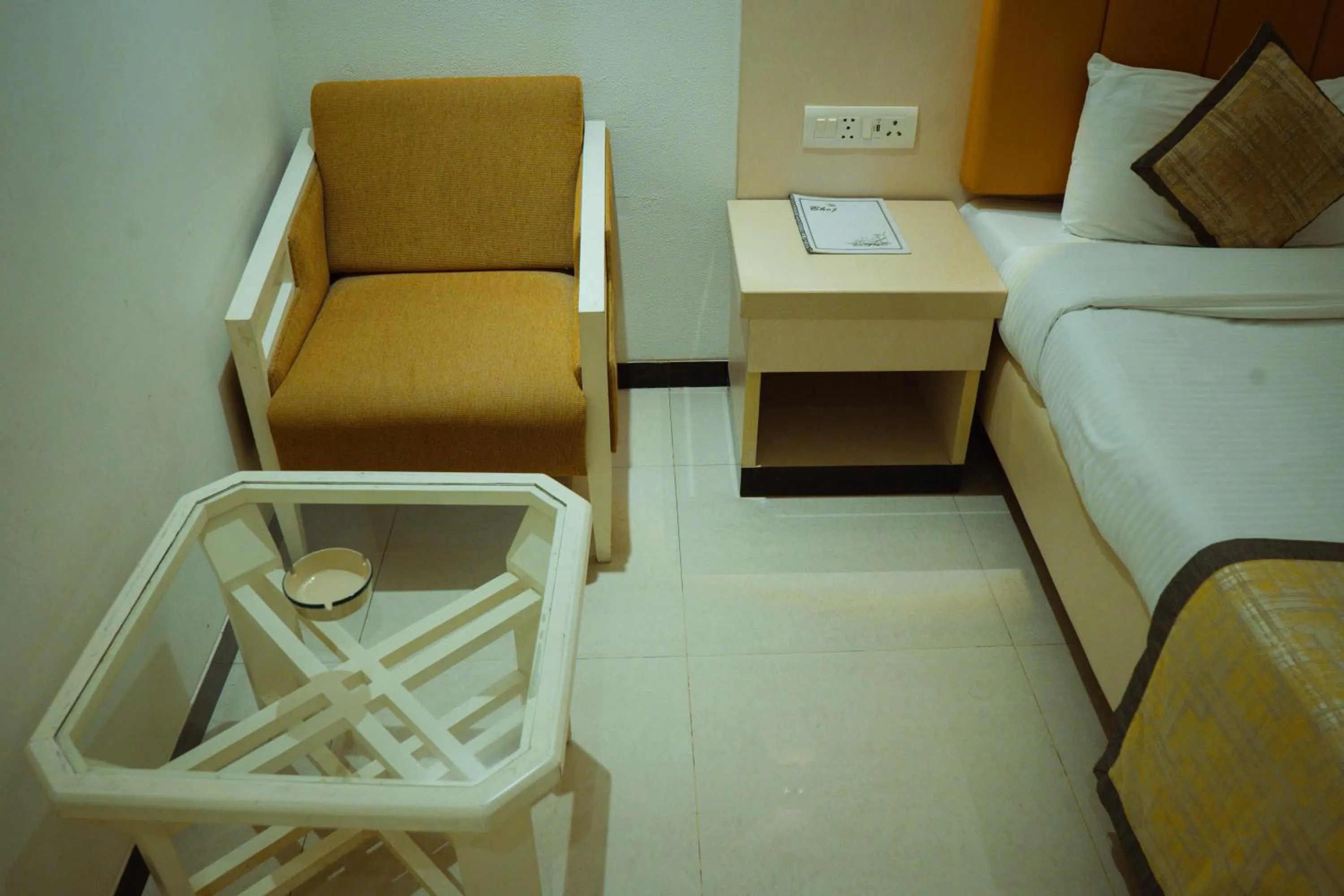 Seating area, Bed in Hotel Yatrik