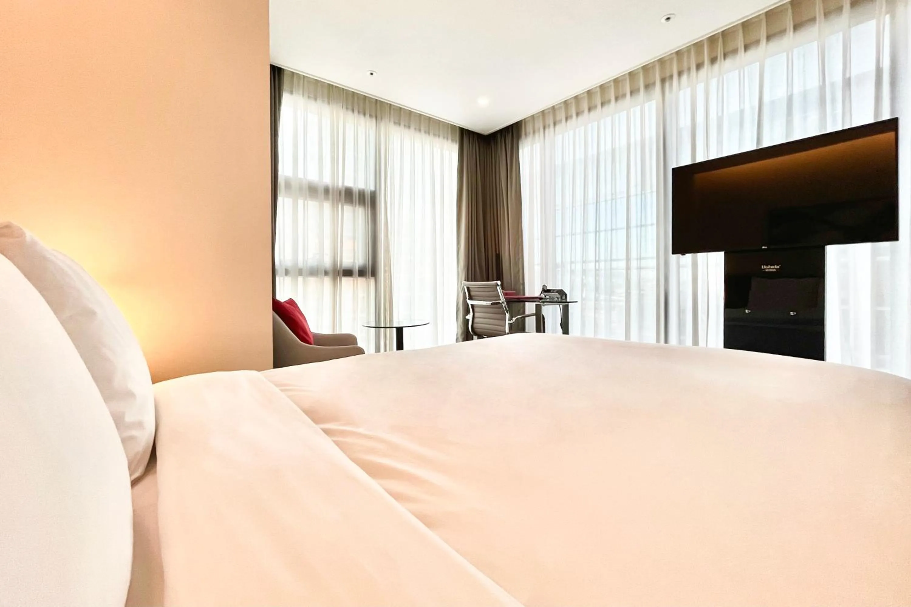 Bed in Ramada Encore by Wyndham Busan Station