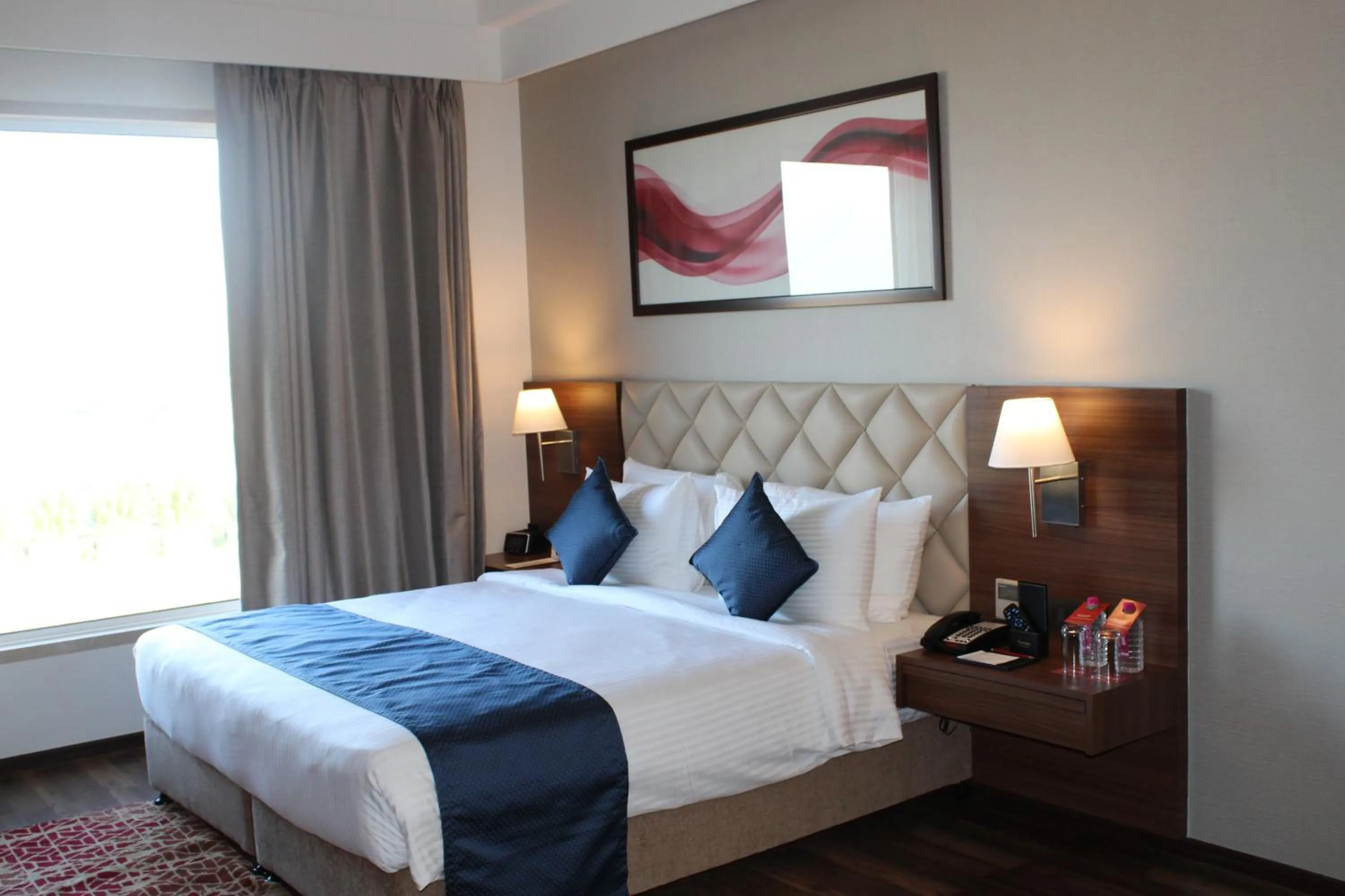 Bedroom, Bed in Ramada by Wyndham Gandhidham Shinay