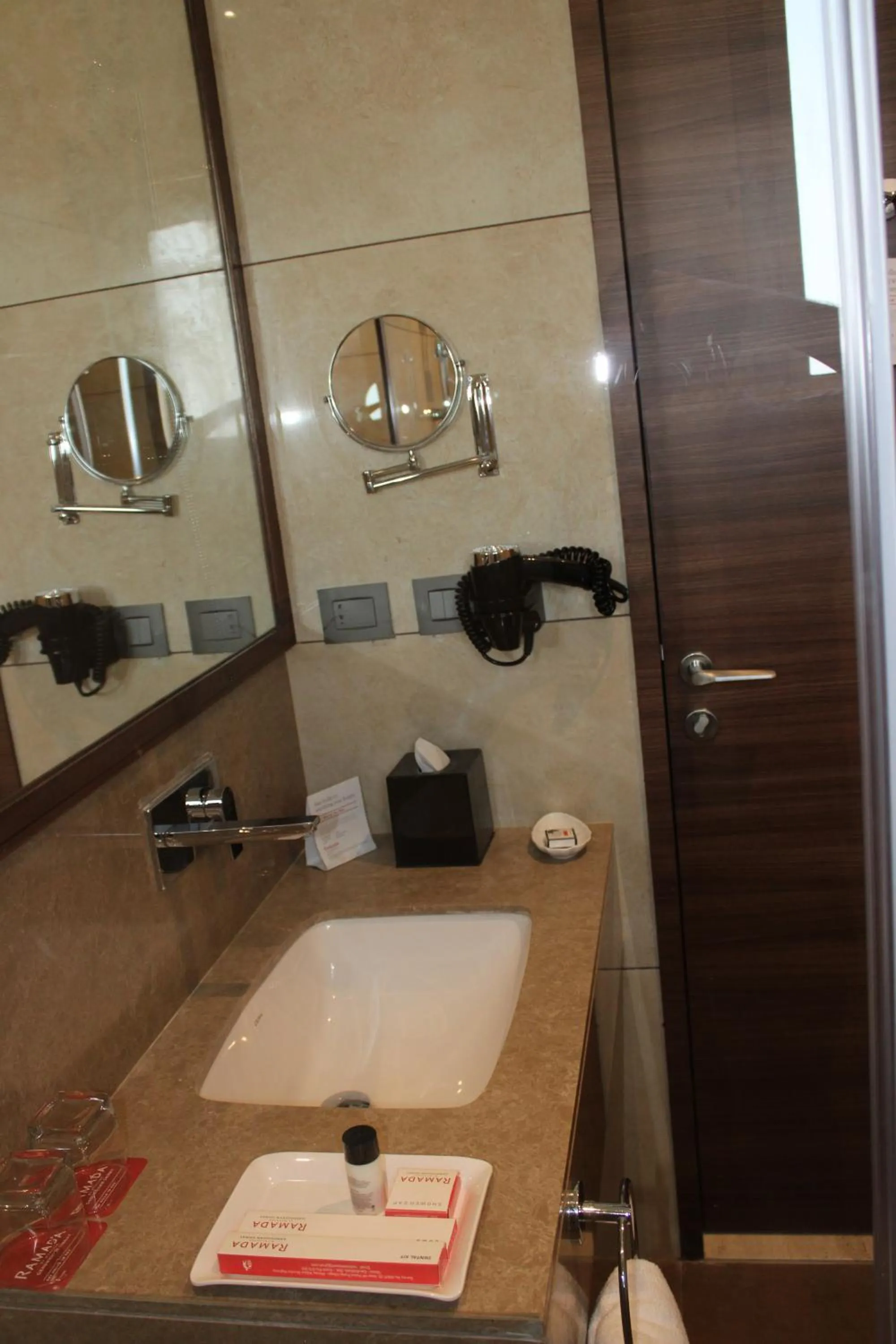 Bathroom in Ramada by Wyndham Gandhidham Shinay