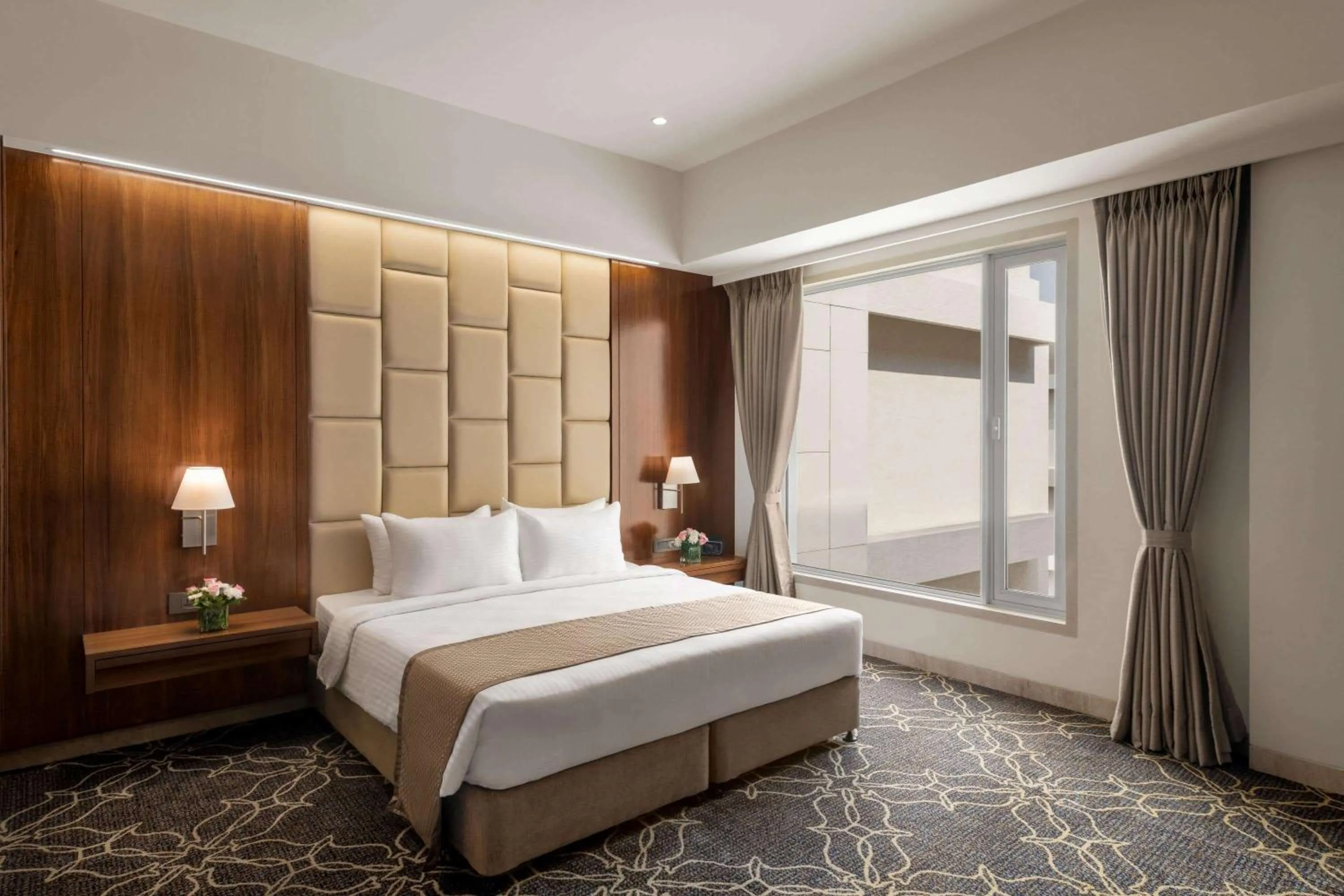 Photo of the whole room, Bed in Ramada by Wyndham Gandhidham Shinay