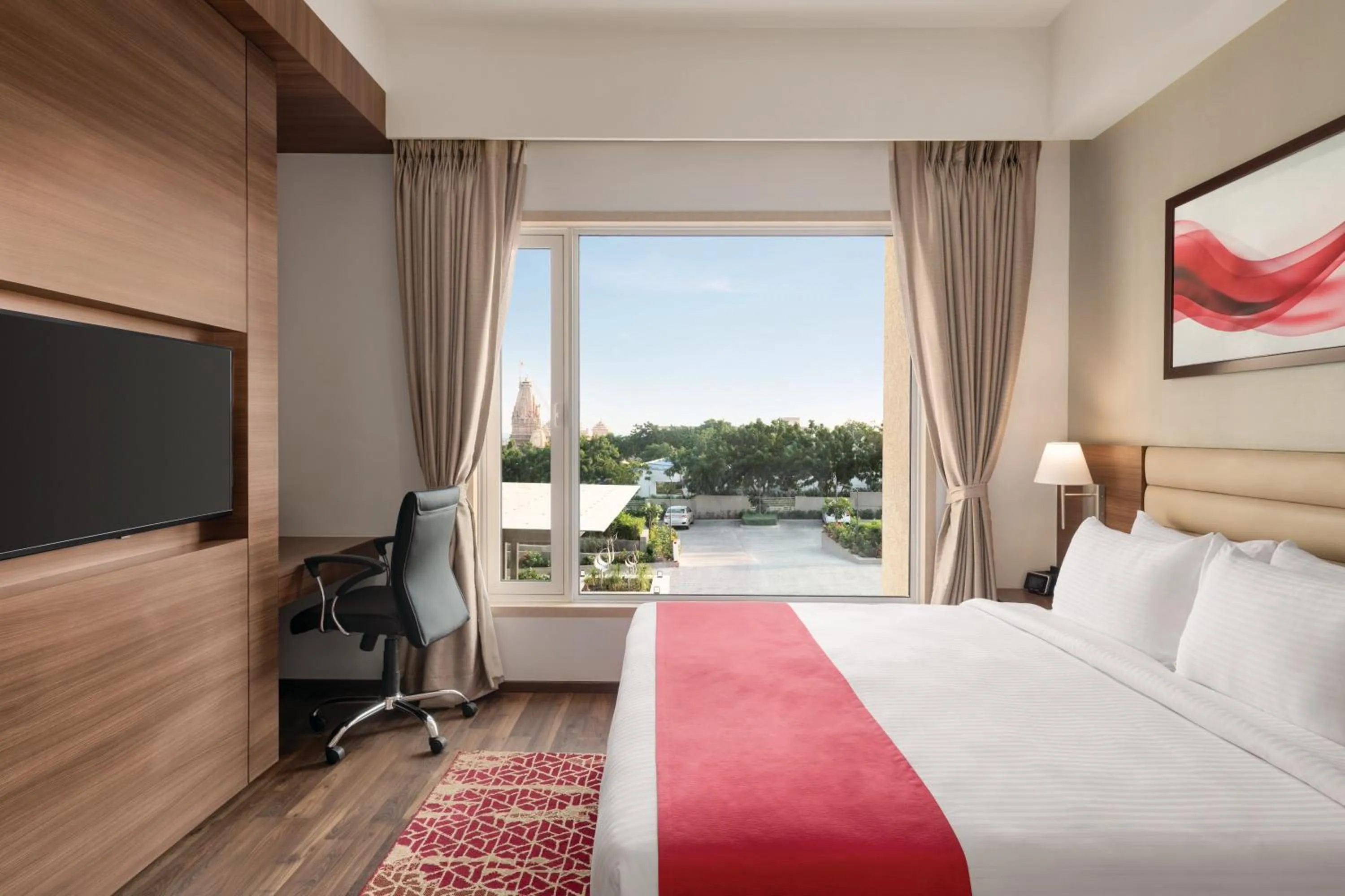 Photo of the whole room, Bed in Ramada by Wyndham Gandhidham Shinay