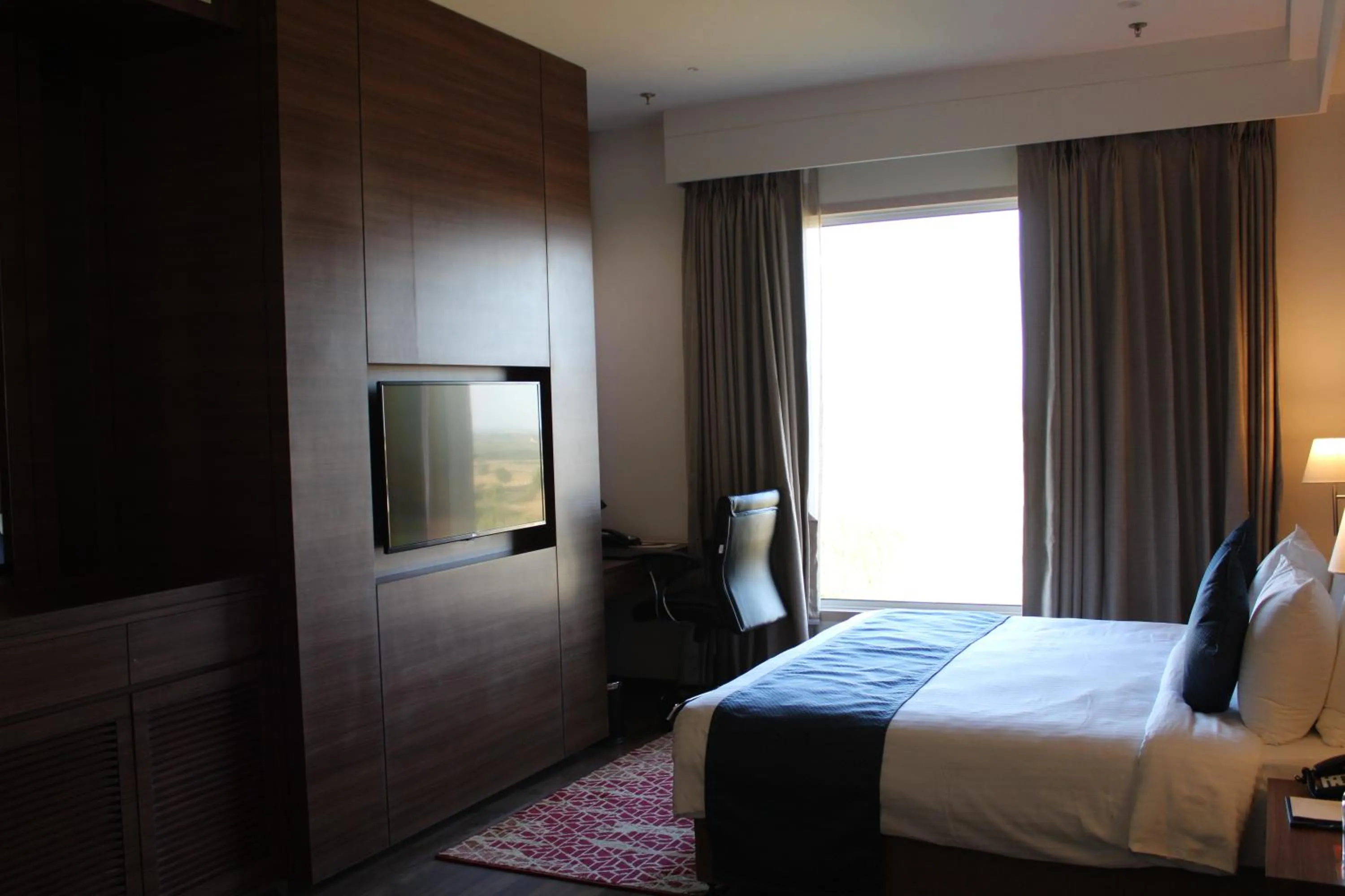 Bedroom, Bed in Ramada by Wyndham Gandhidham Shinay