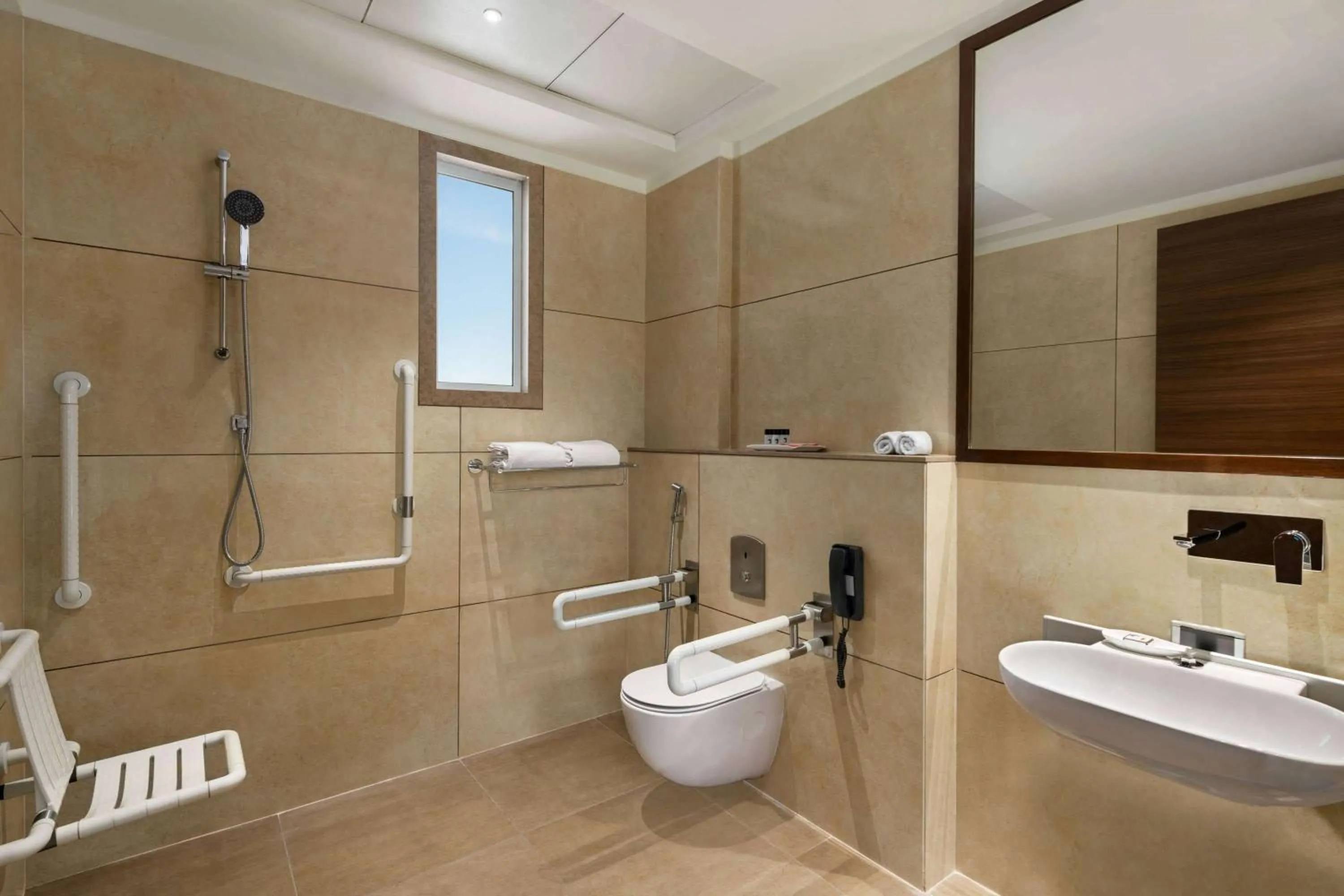 Bathroom in Ramada by Wyndham Gandhidham Shinay