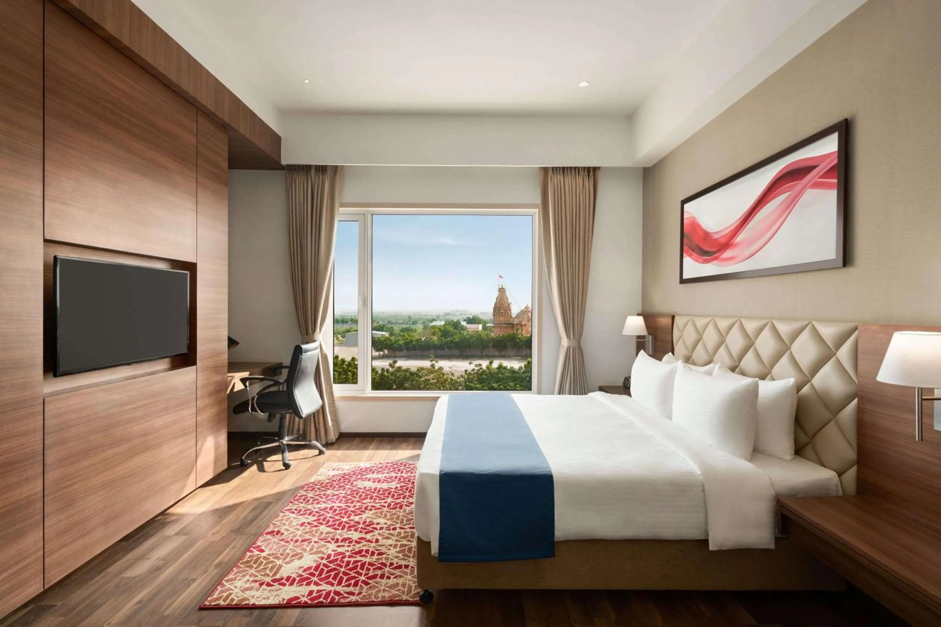 Photo of the whole room, Bed in Ramada by Wyndham Gandhidham Shinay