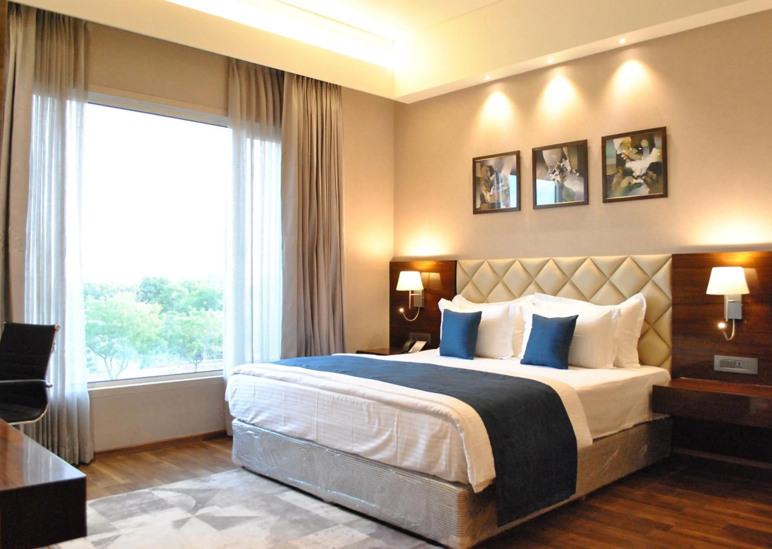 Bedroom, Bed in Ramada by Wyndham Gandhidham Shinay