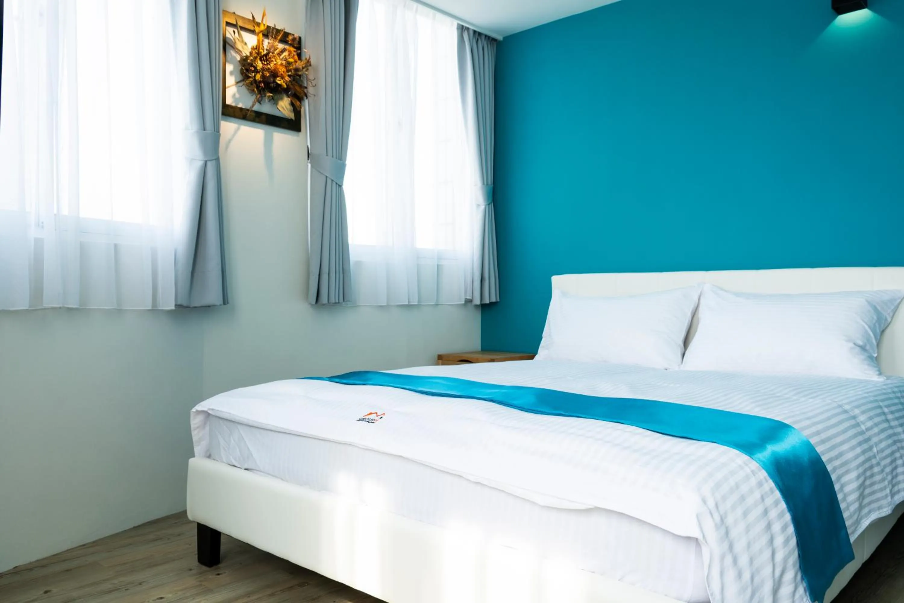 Bed in 沐藍輕旅 Mulan Light Inn I 海安路住宿