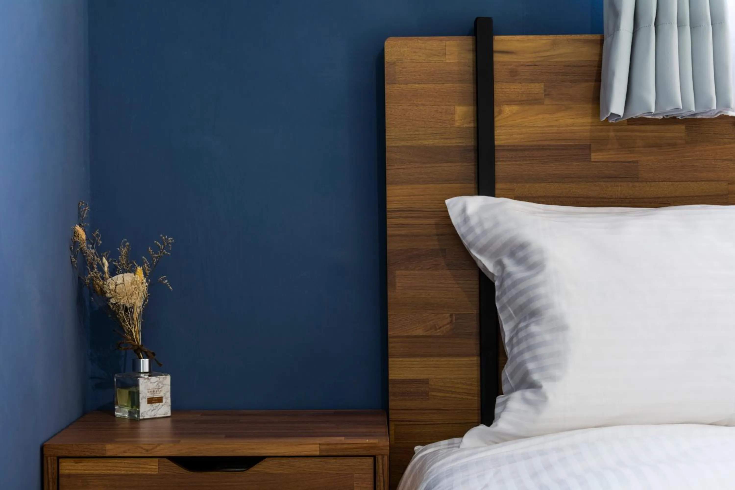 Bed in 沐藍輕旅 Mulan Light Inn I 海安路住宿