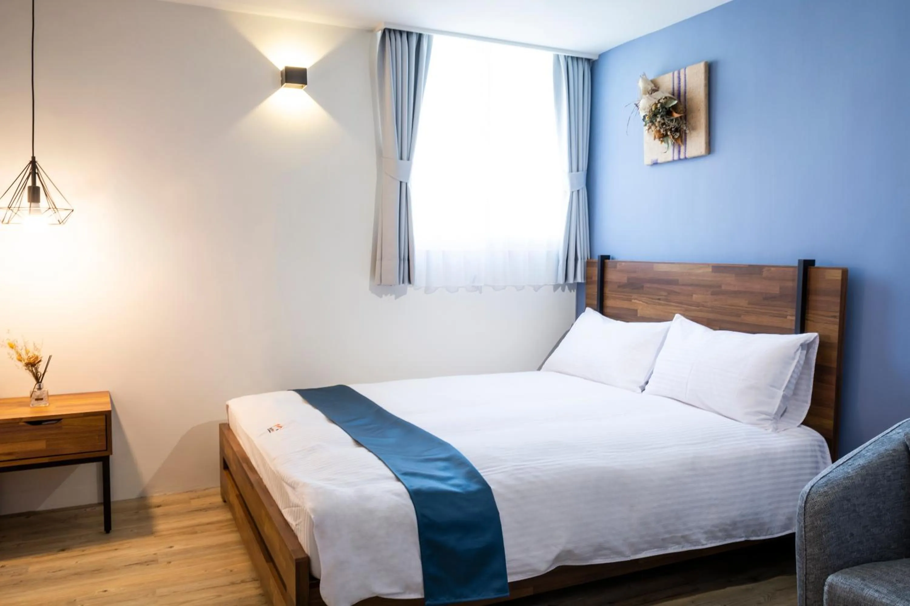 Bed in 沐藍輕旅 Mulan Light Inn I 海安路住宿