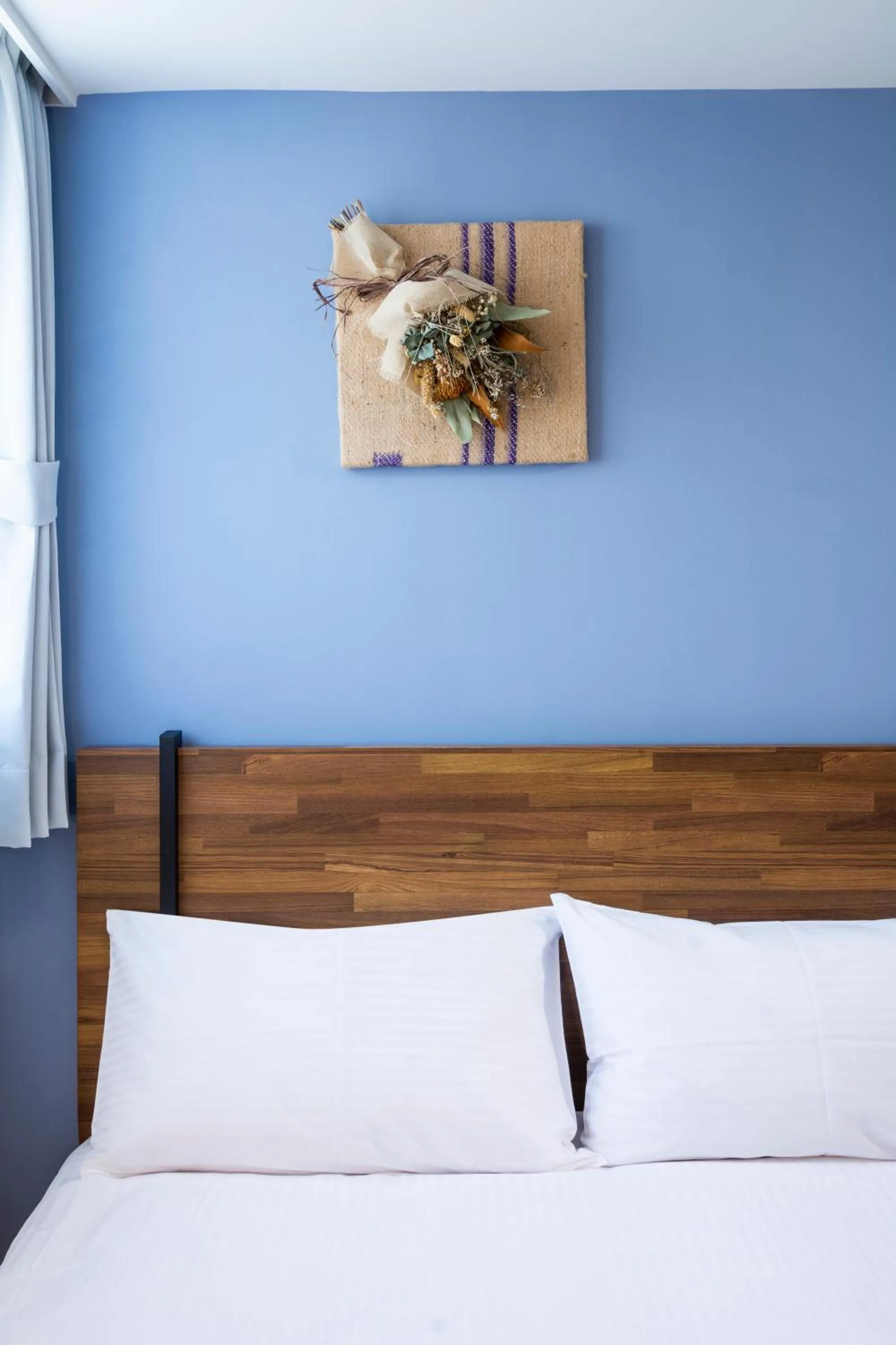 Bed in 沐藍輕旅 Mulan Light Inn I 海安路住宿