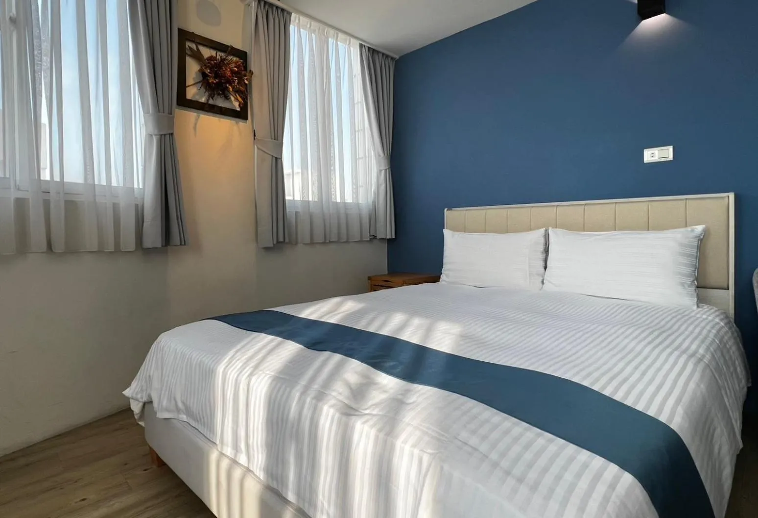 Bed in 沐藍輕旅 Mulan Light Inn I 海安路住宿