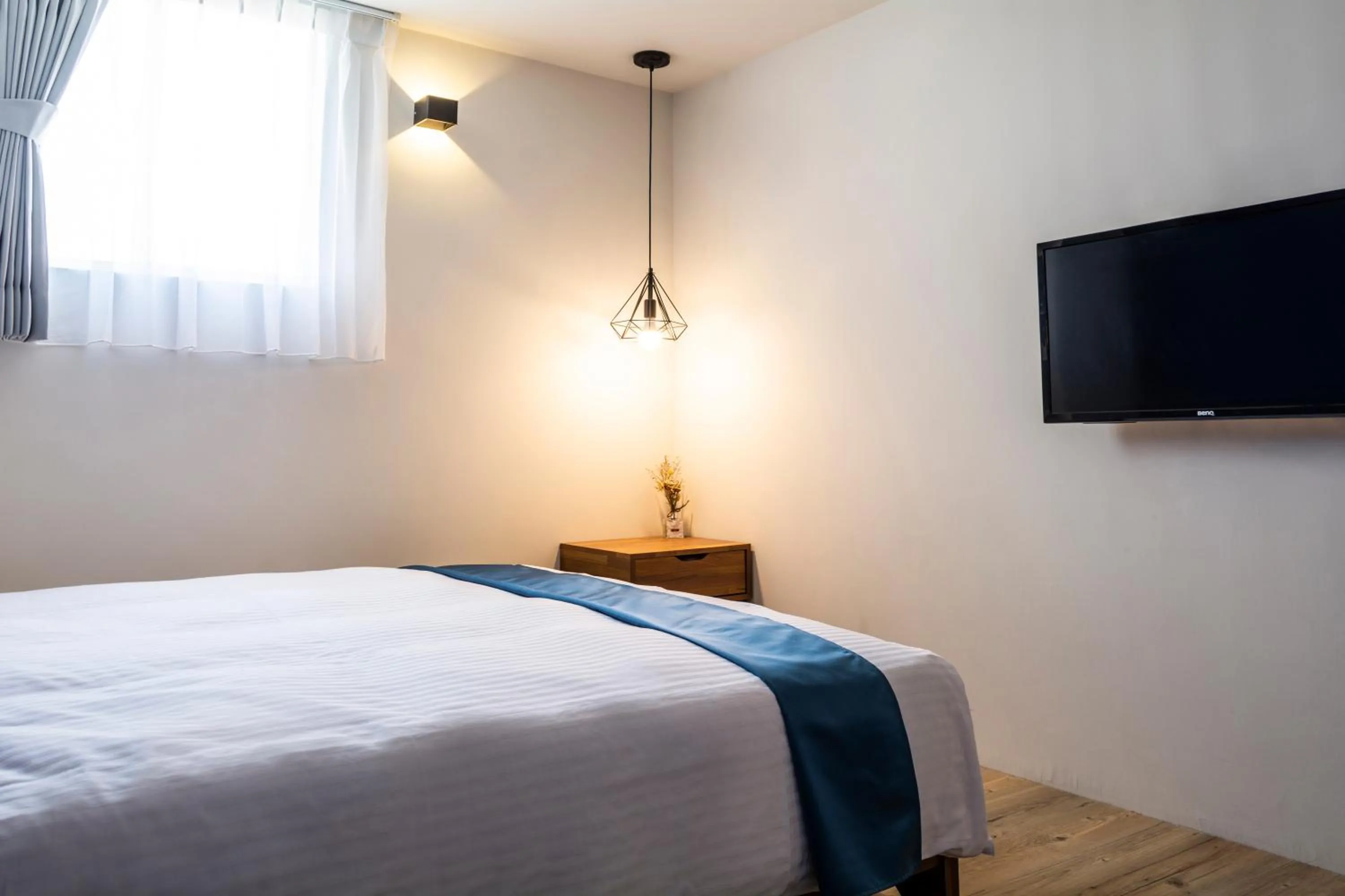 Bed in 沐藍輕旅 Mulan Light Inn I 海安路住宿