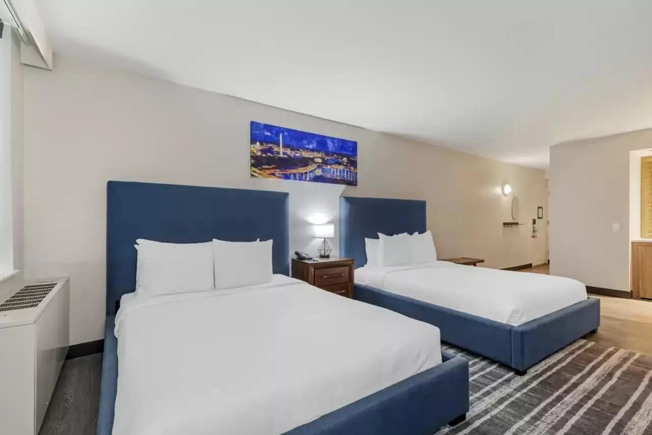 Bed in The Quincy, an Ascend Collection Hotel