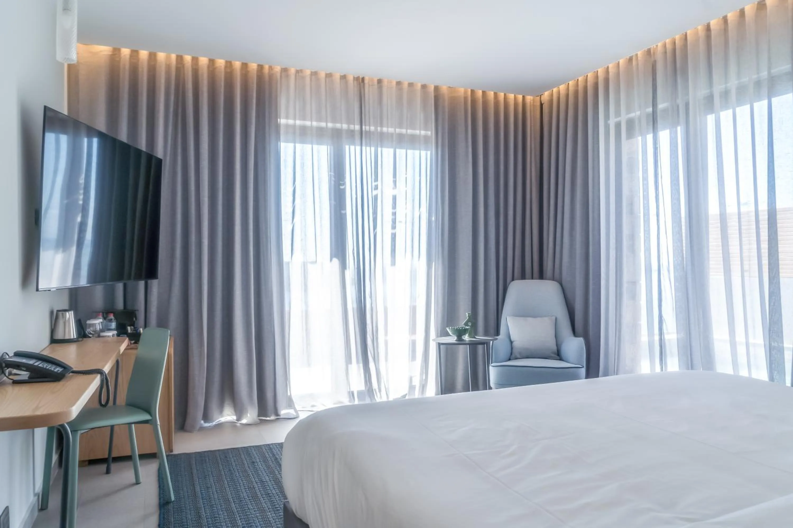 Bed in Cayo Exclusive Resort & Spa