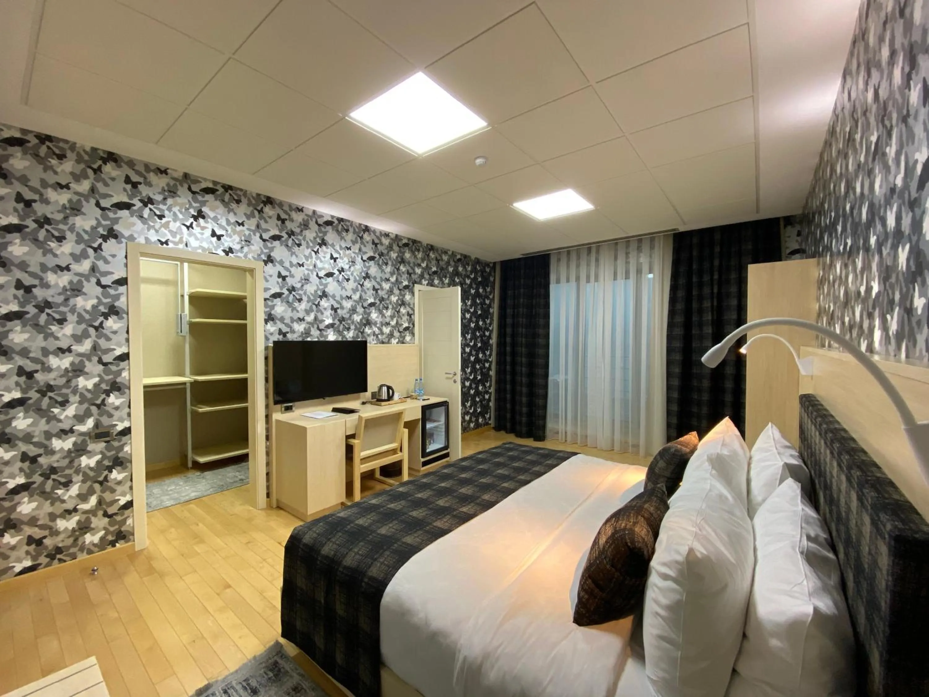 Communal lounge/ TV room, Bed in Badam d'Art Boutique Hotel