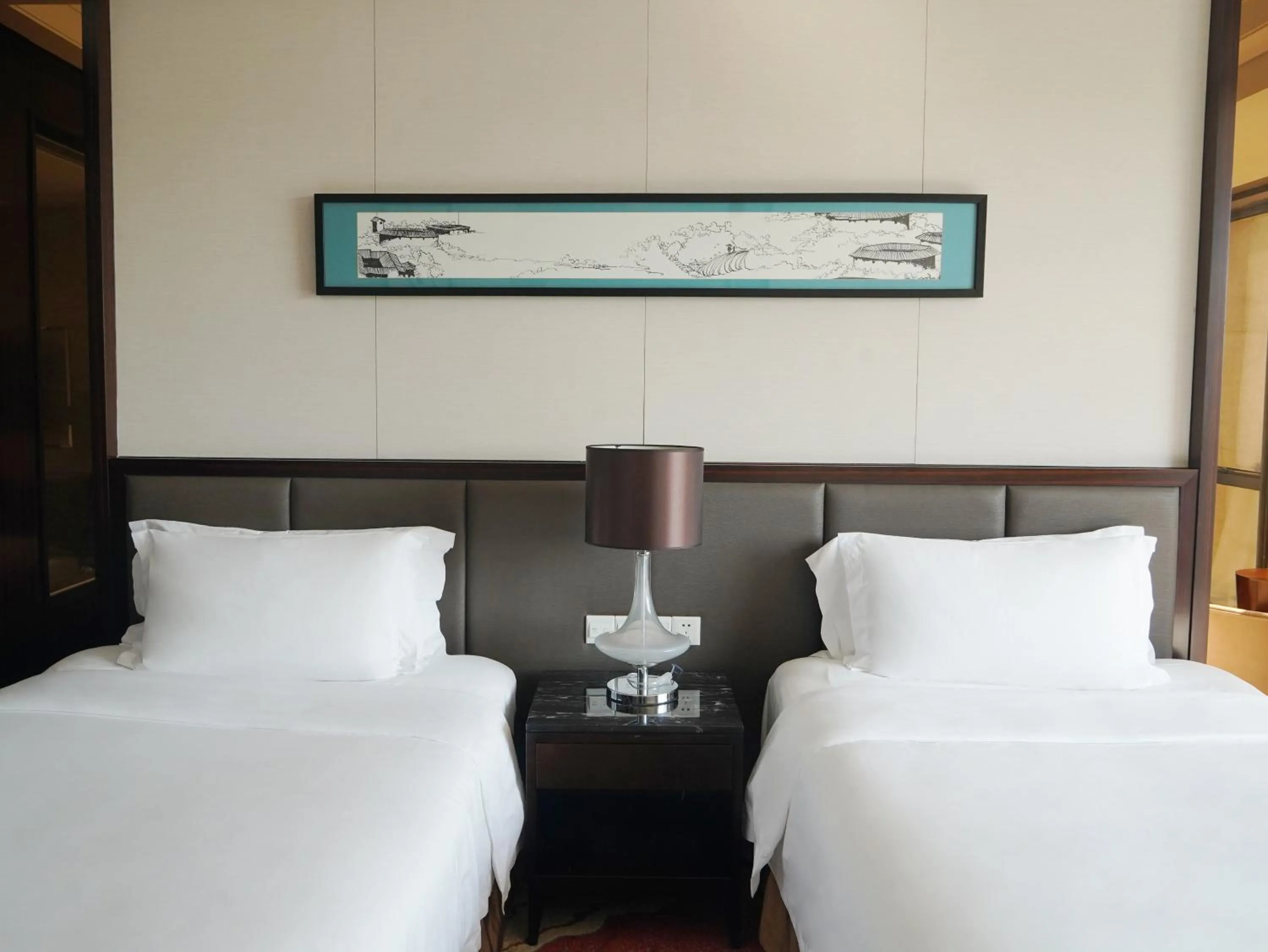 Bed in Howard Johnson Changsheng Plaza Meizhou