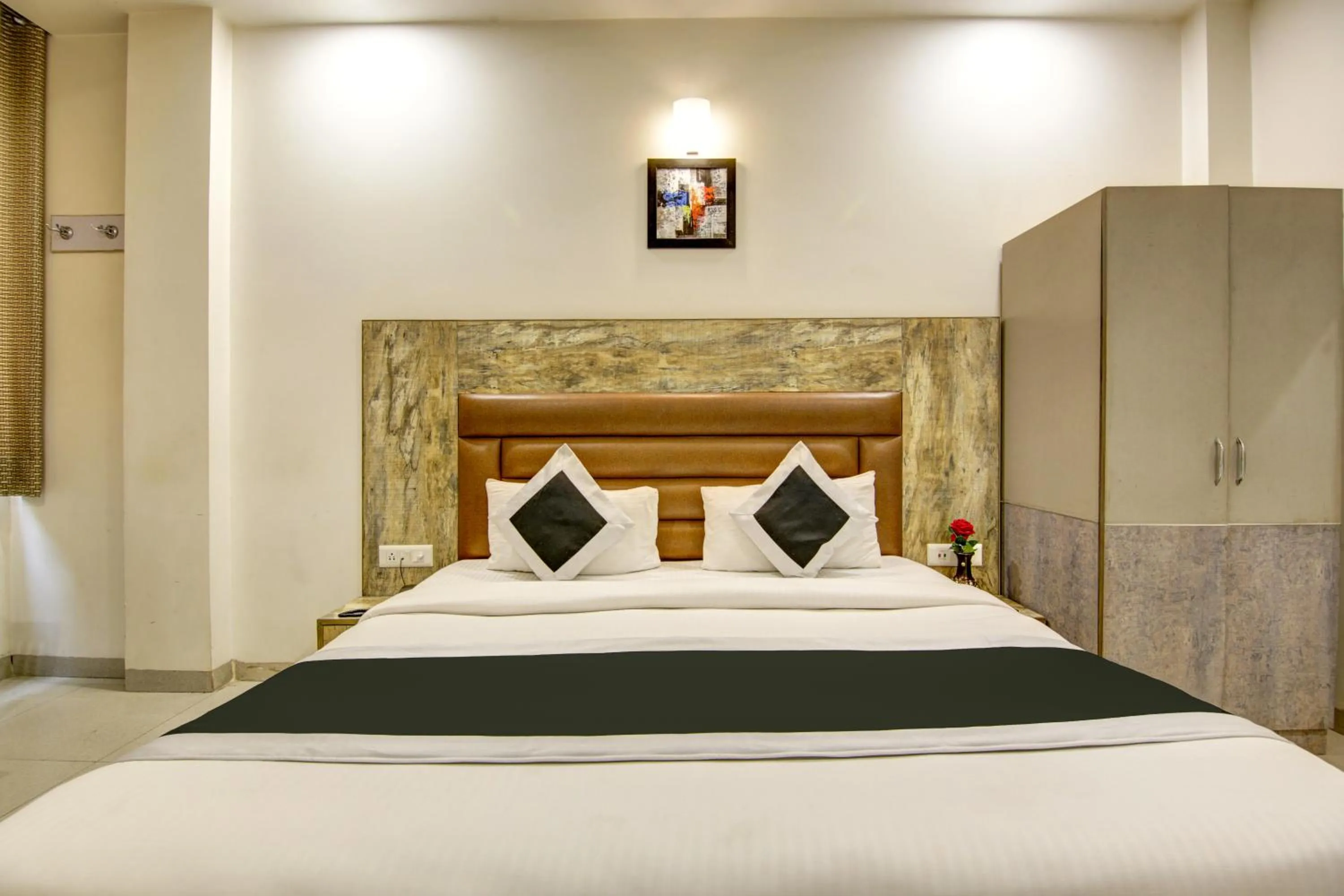 wardrobe, Bed in Gracious by Vishesh Hotels & Home Stay