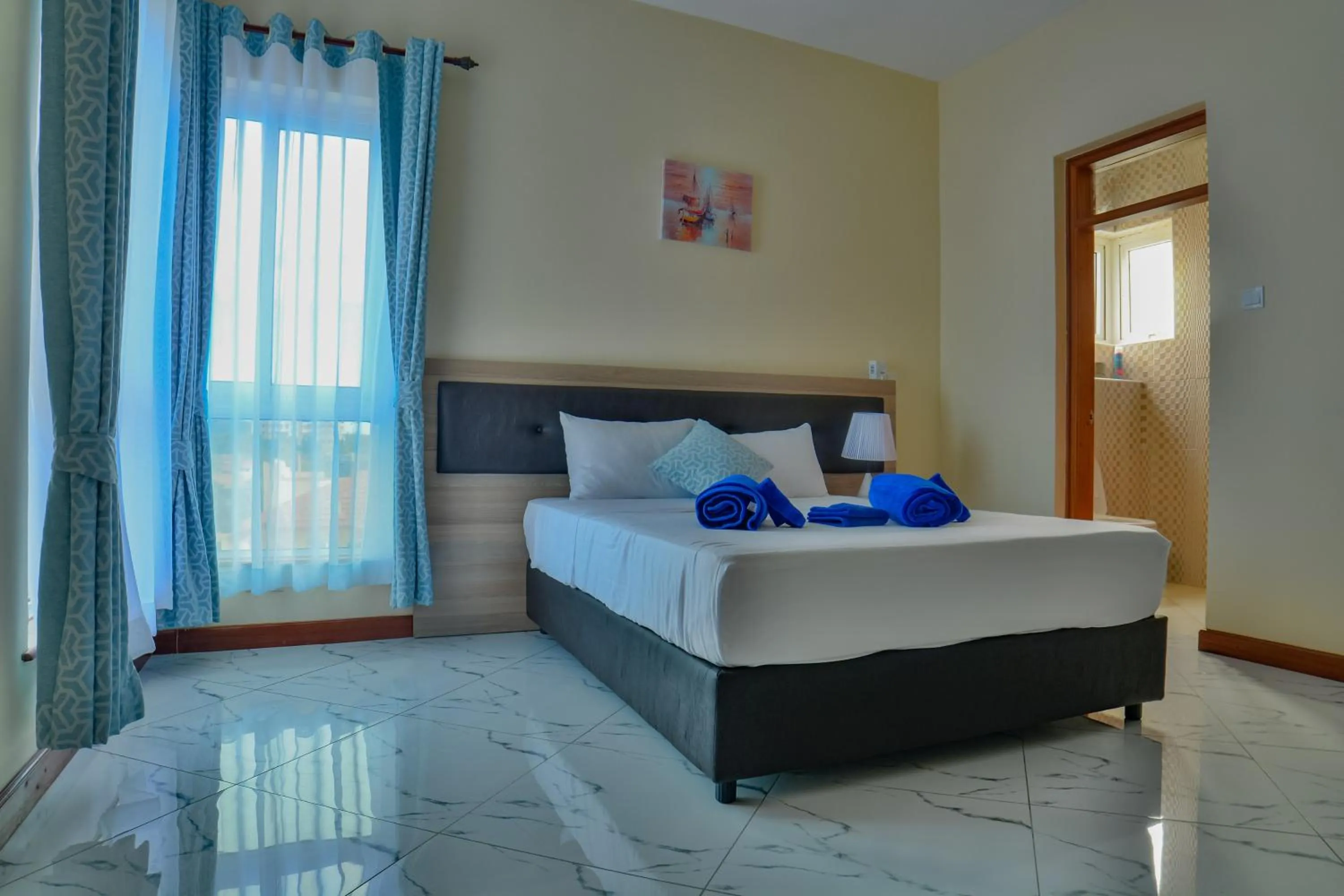 Bed in Fenns Cozy Apartment - Nyali