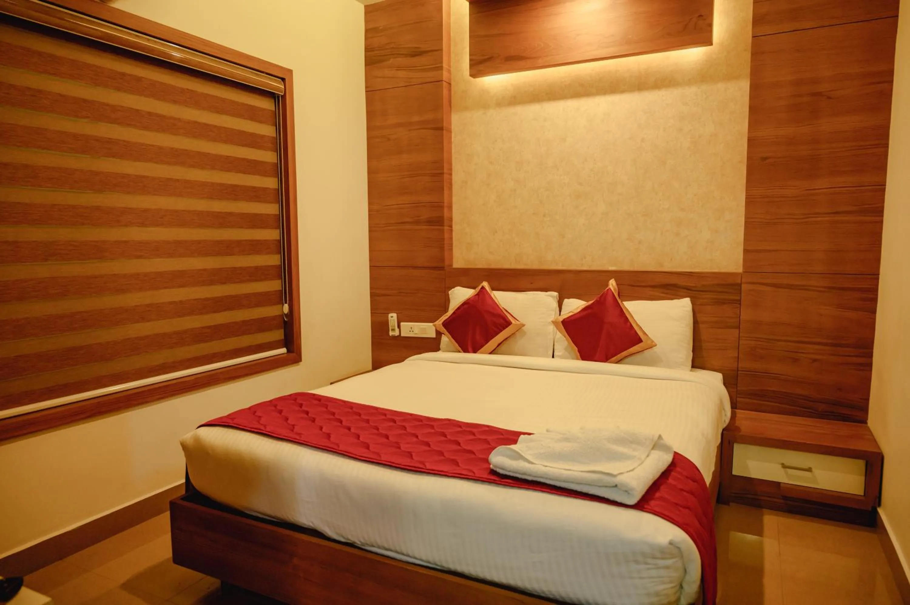 Dining area, Bed in Royal Plaza Wayanad