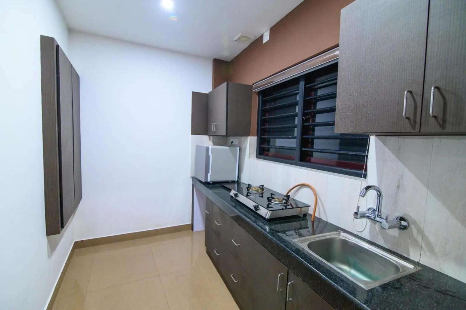 Kitchen or kitchenette in Royal Plaza Wayanad
