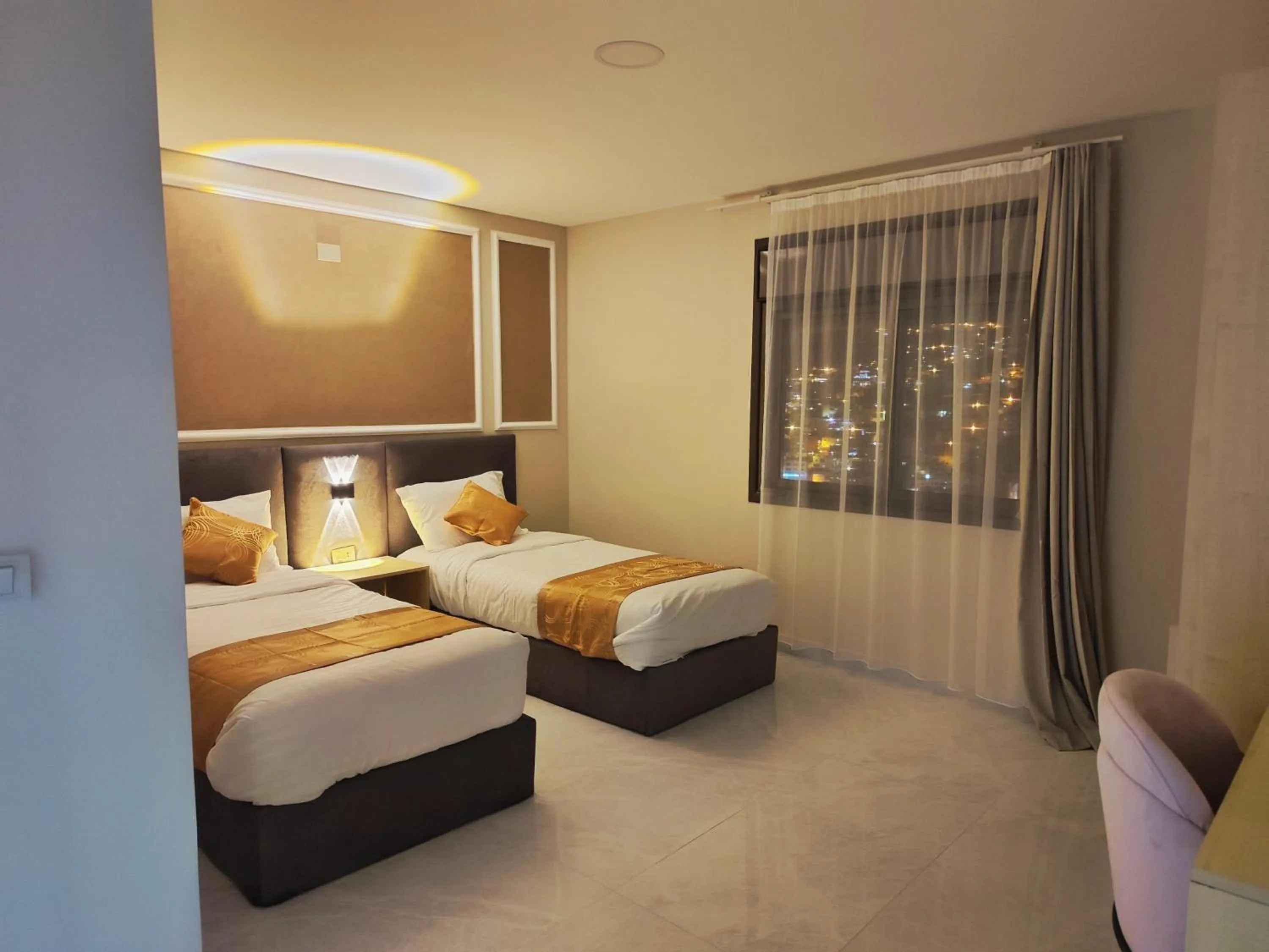 Bed in Rakan ApartHotel and Luxury Rooms