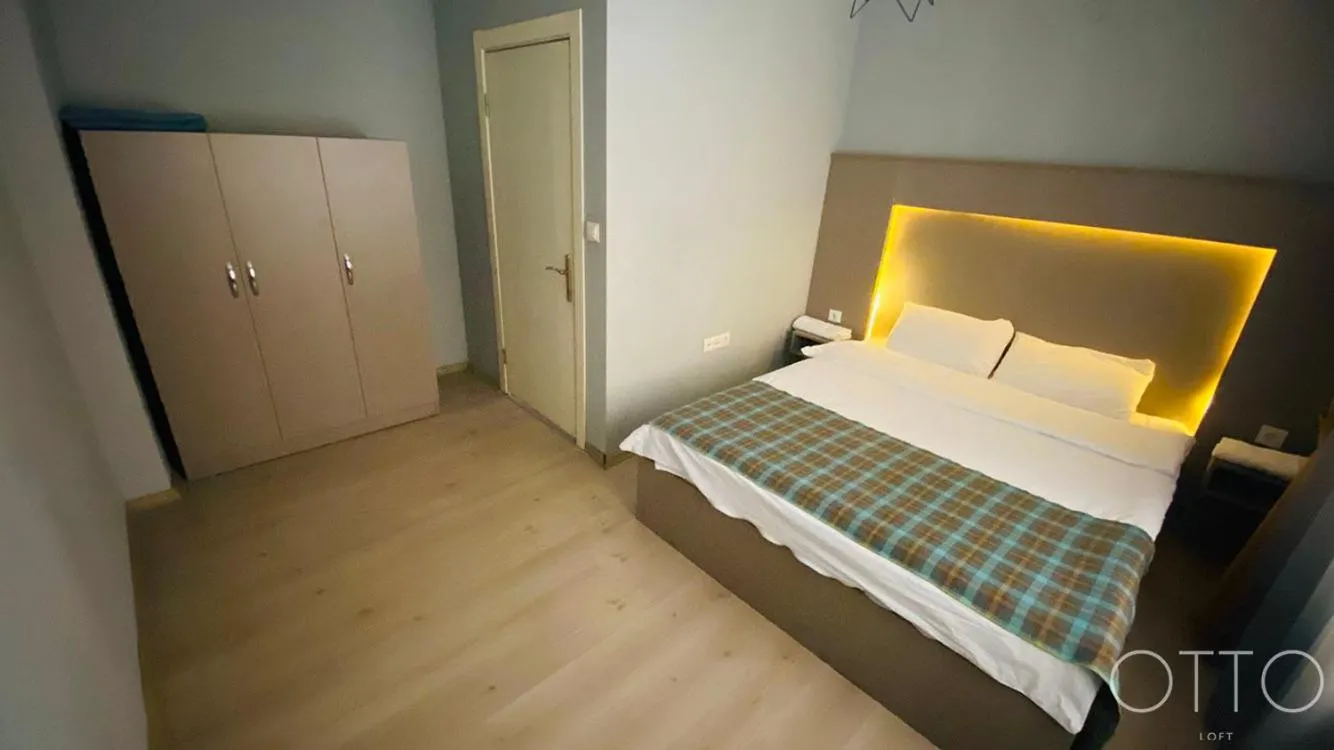 Bed in OTTO LOFT Premium Apartments