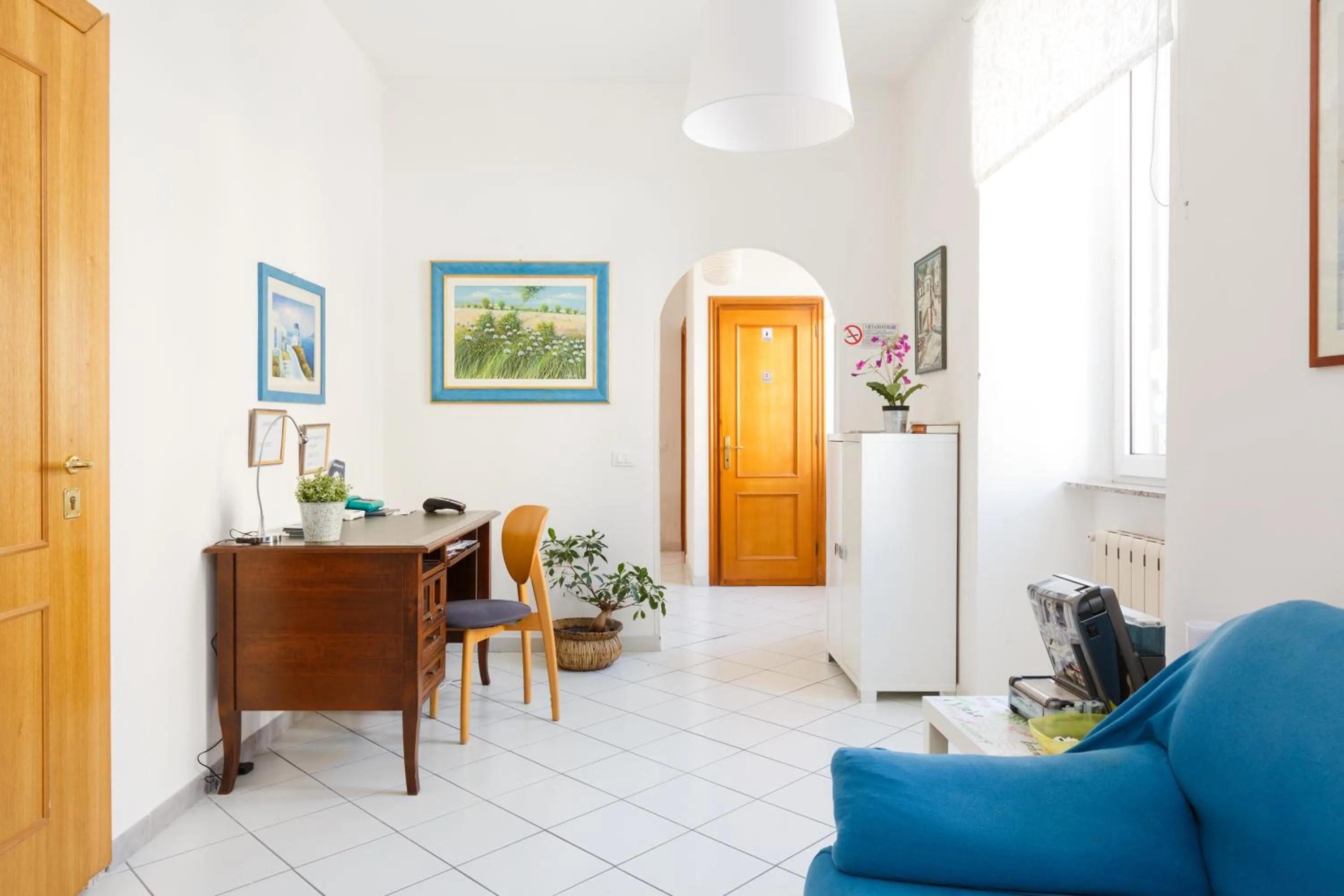 Communal lounge/ TV room in B&B Piazza Fratti