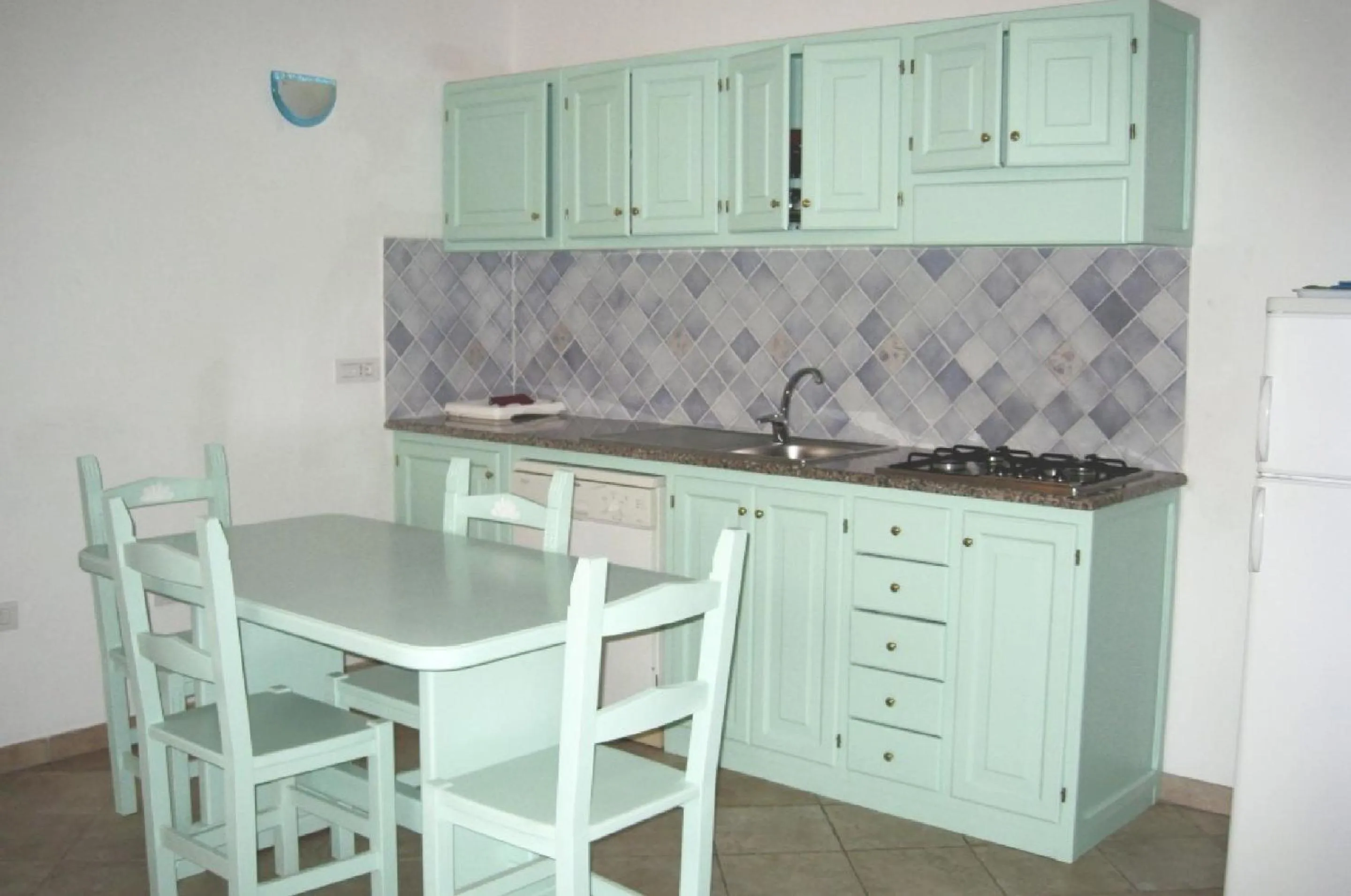 Kitchen or kitchenette in Residence Baia Santa Reparata