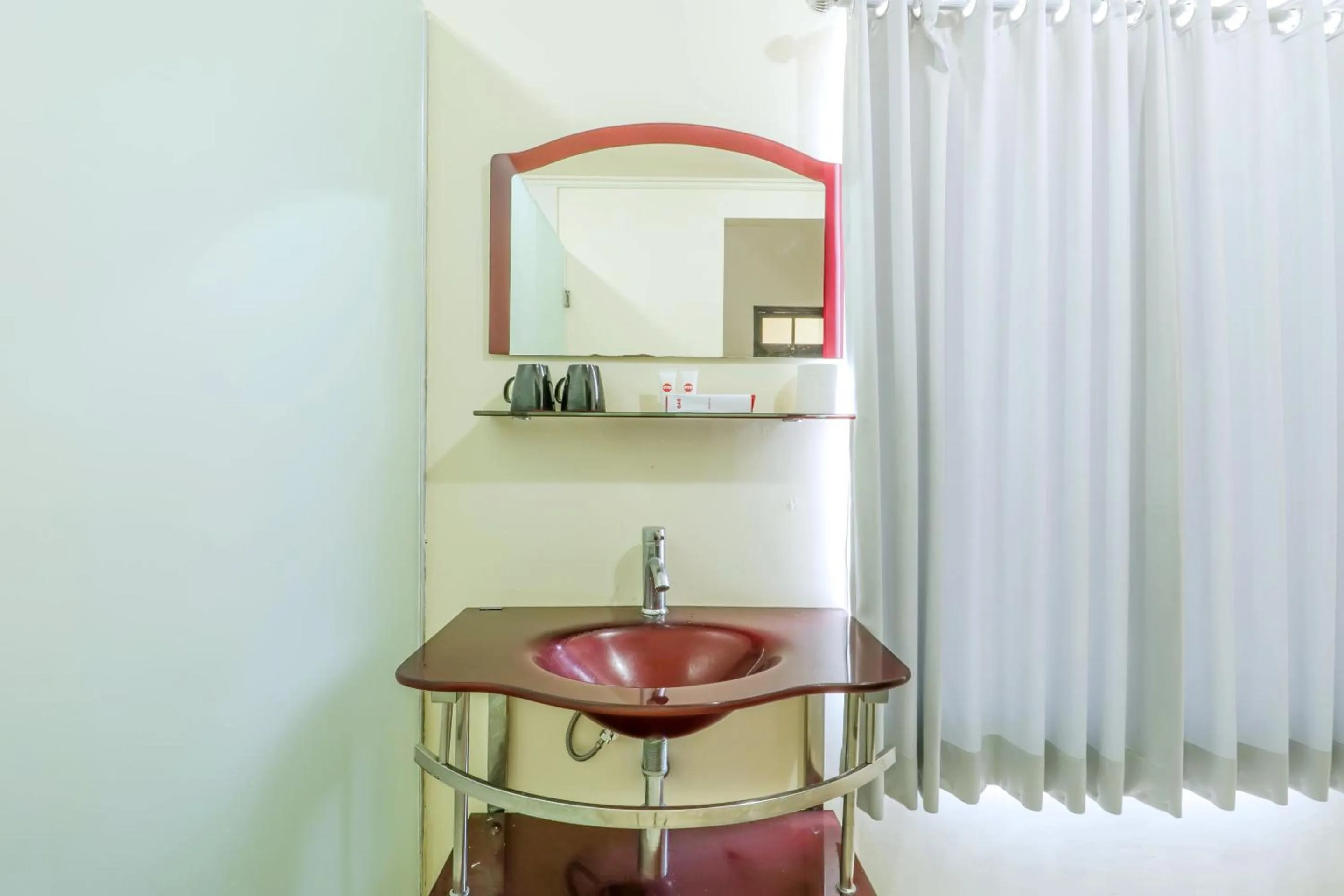 Bathroom in OYO 1684 Marina Suite Apartment Bali