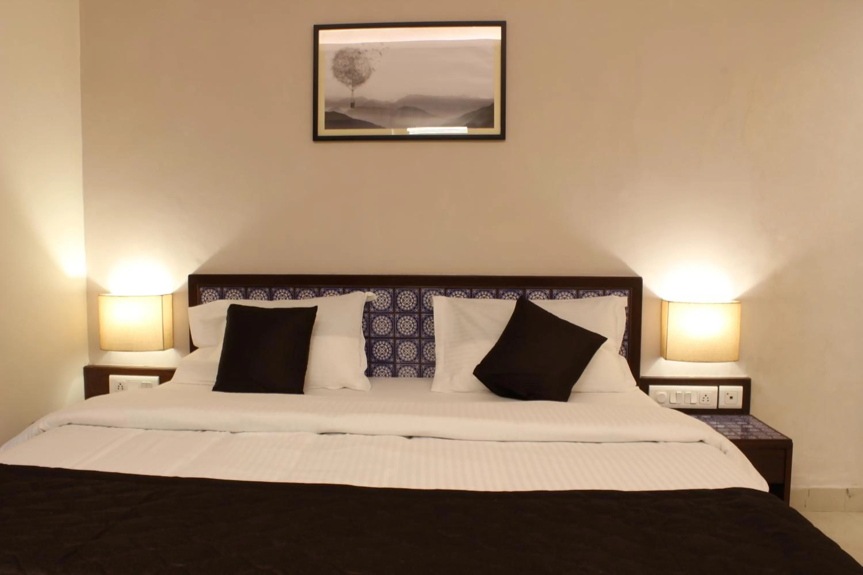 Bed in Ria Residency