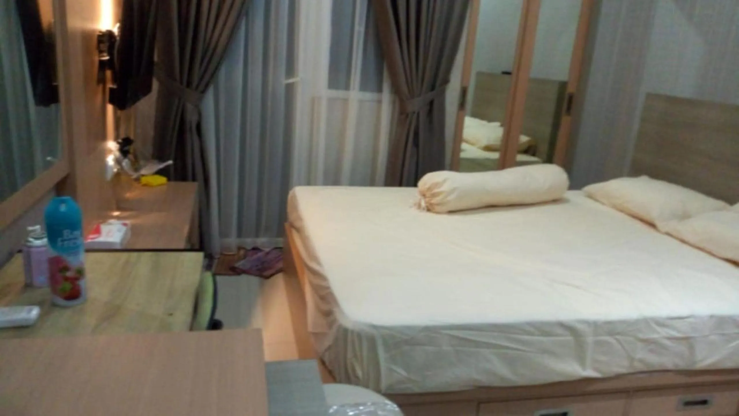 Bed in Apartment Green Pramuka by Vincent