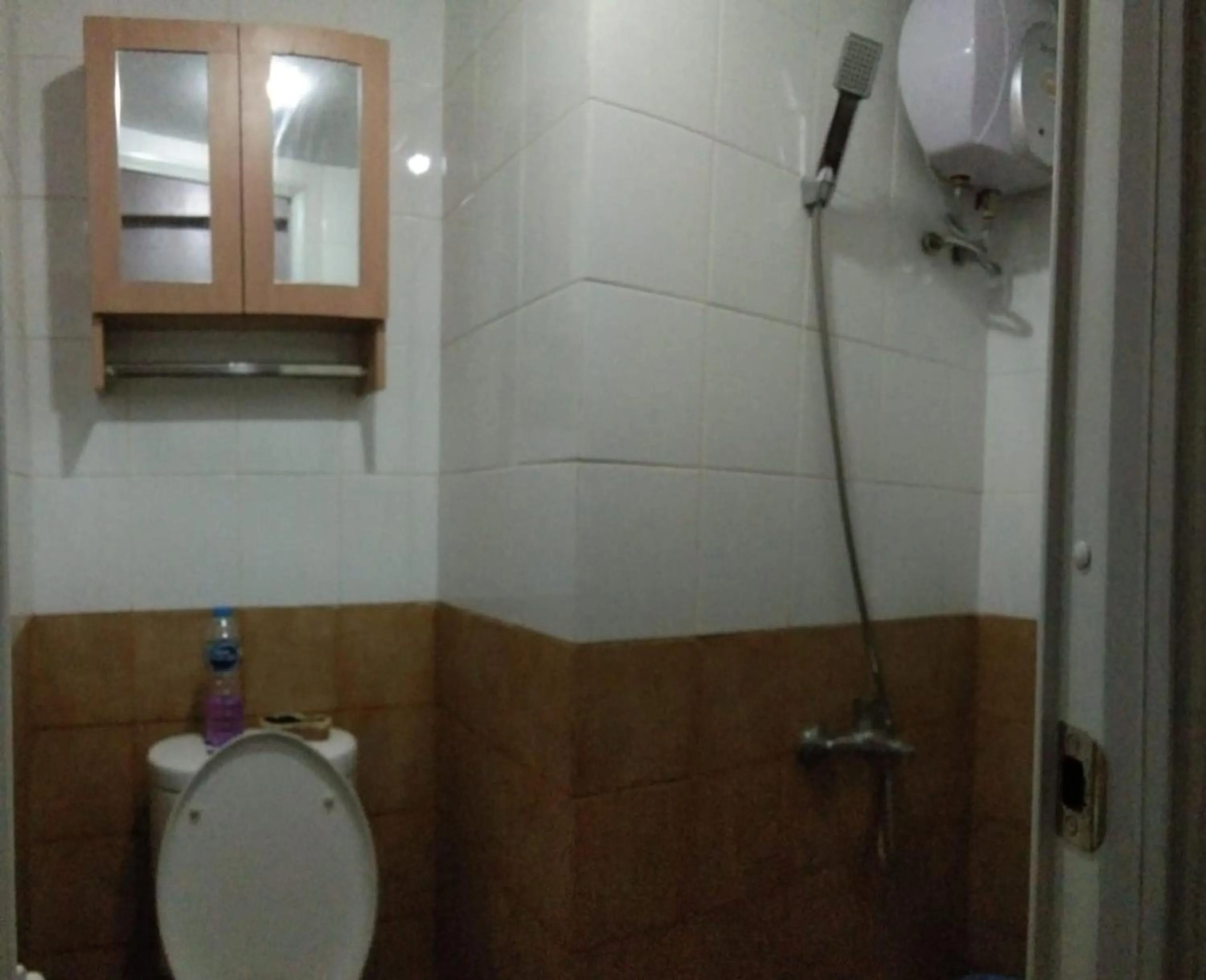 Bathroom in Apartment Green Pramuka by Vincent