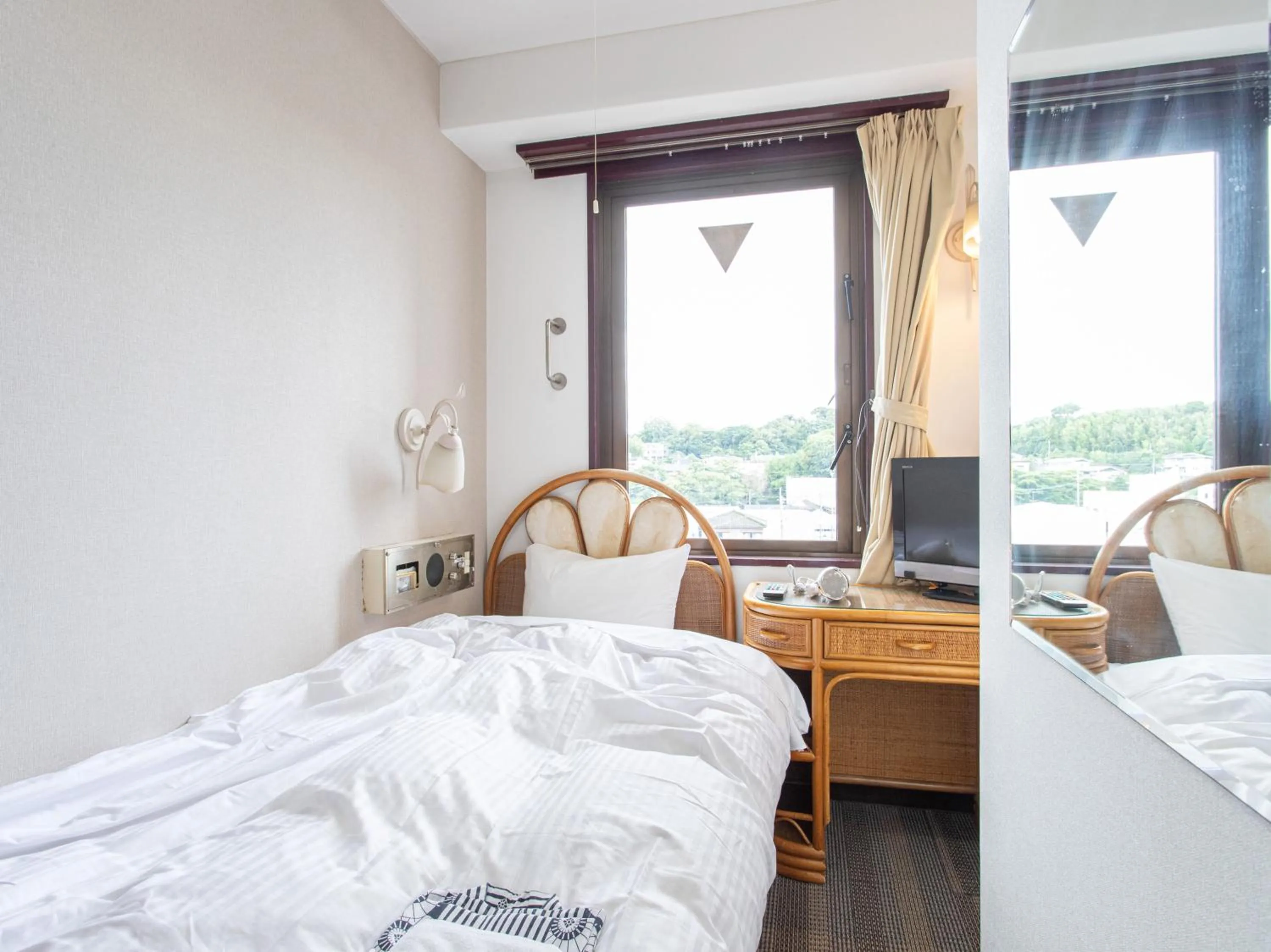 Photo of the whole room, Bed in Tabist New World Hotel Kagoshima Kanoya