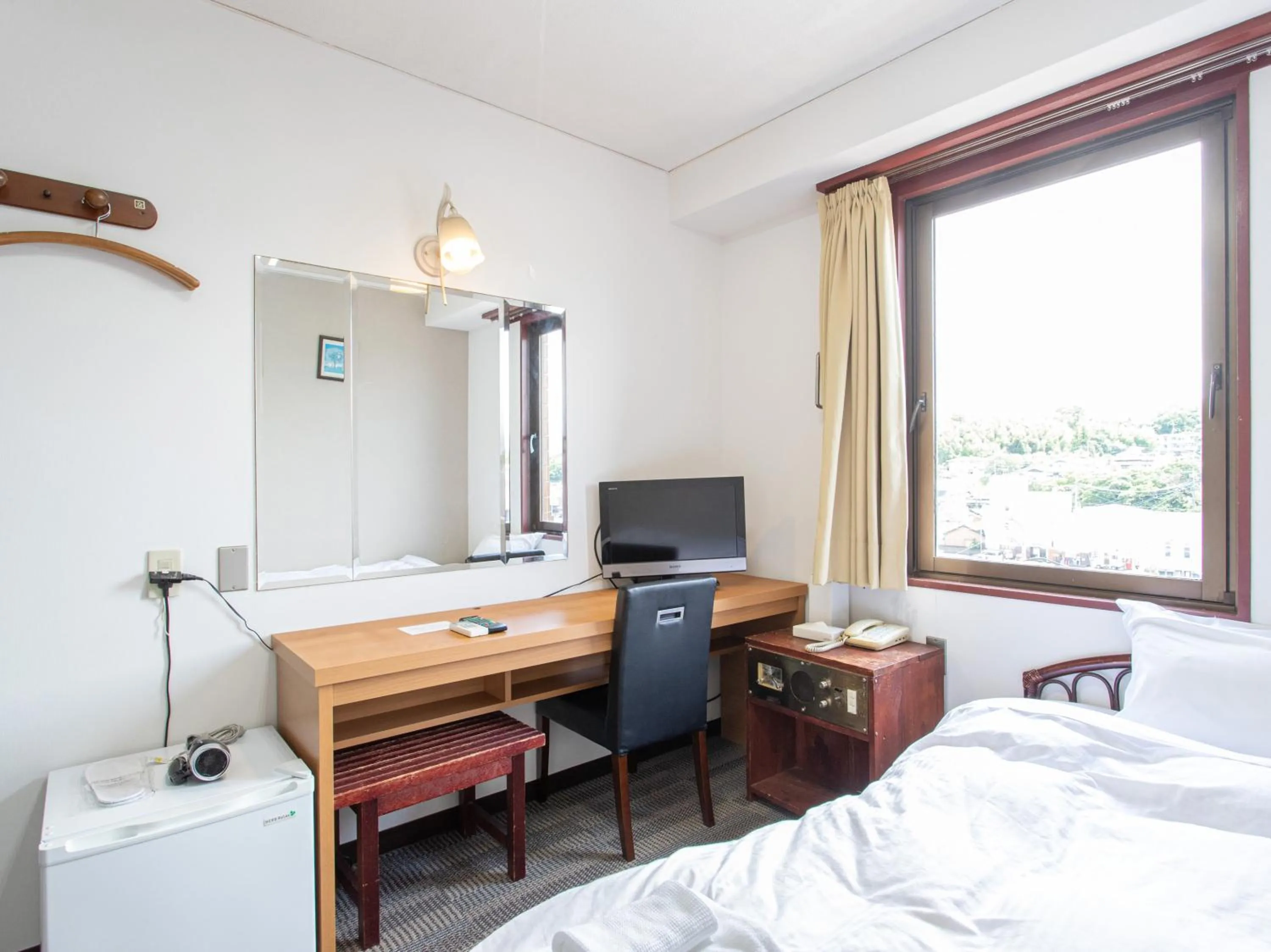 Photo of the whole room, Bed in Tabist New World Hotel Kagoshima Kanoya